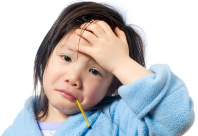 A young girl is sick and having her temperature taken.