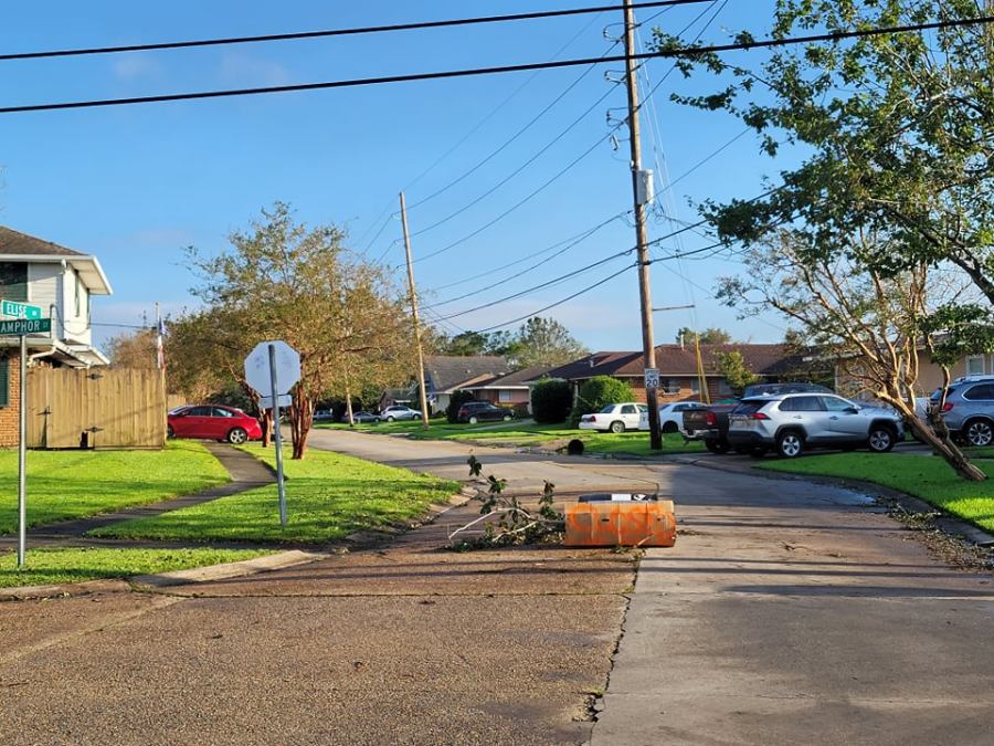 Neighbors block off street in Metairie; downed trees preventing access