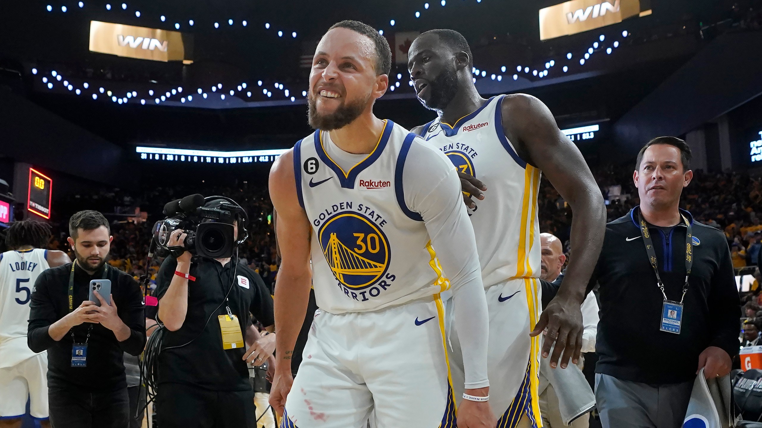 Golden State Warriors guard Stephen Curry (30) celebrates with forward Draymond Green after the Warriors defeated the Sacramento Kings in Game 4 in the first round of the NBA basketball playoffs in San Francisco, Sunday, April 23, 2023. (AP Photo/Jeff Chiu)