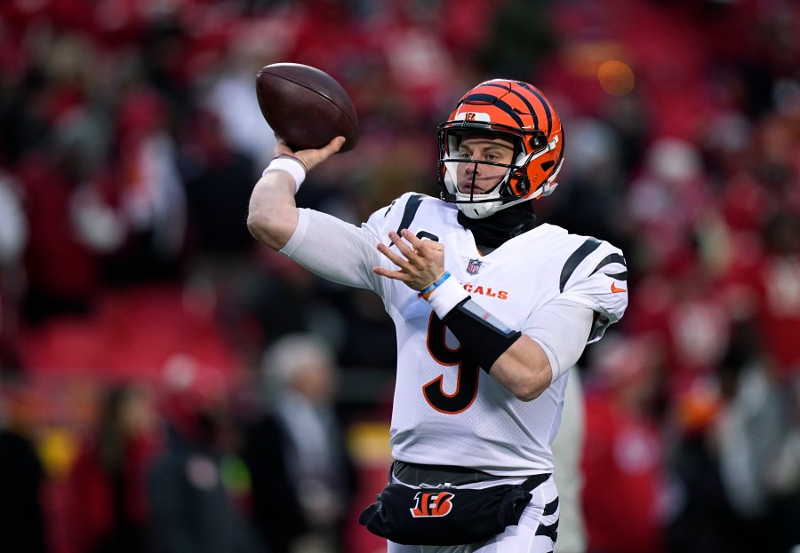 FILE - Cincinnati Bengals quarterback Joe Burrow throws a pass against the Kansas City Chiefs during the first half of the AFC championship NFL football game Jan. 29, 2023, in Kansas City, Mo. The Bengals exercised the fifth-year contract option on Burrow as they move toward signing him to a long-term deal. The Bengals said they made the “mechanical step" Tuesday, April 25, as they work with Burrow and his representatives toward securing him for the future. (AP Photo/Brynn Anderson, File)