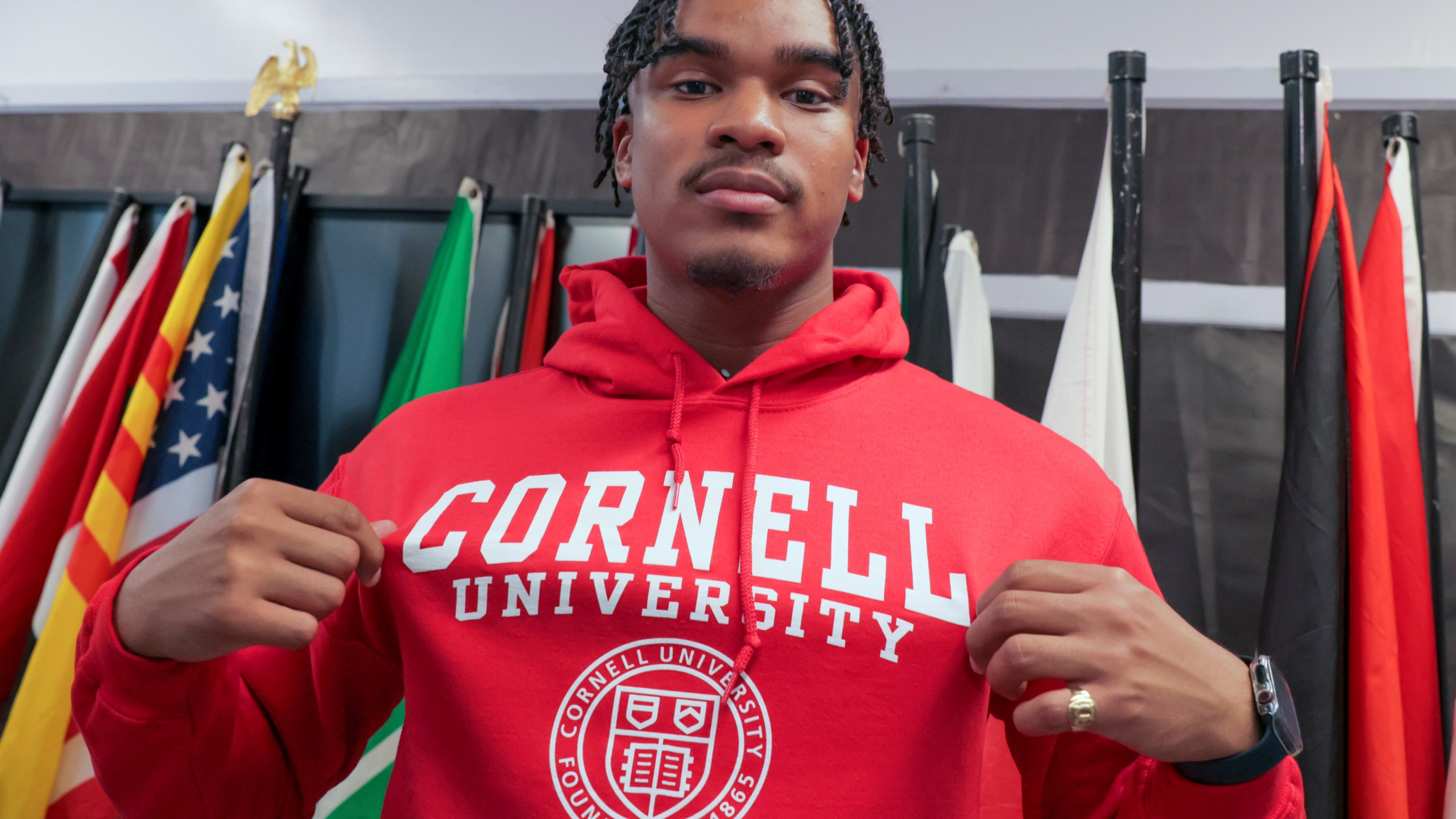 Dennis "Maliq" Barnes, 16, announces that he will be attending Cornell University during a news conference at International High School of New Orleans Friday, May 5, 2023. Barnes received more than 180 college acceptance letters and nabbed more than $10 million in scholarship offers, a new national record that brought international media attention. He will be enrolling in the college of engineering in the fall. (David Grunfeld, NOLA.com/The Times-Picayune/The New Orleans Advocate via AP)