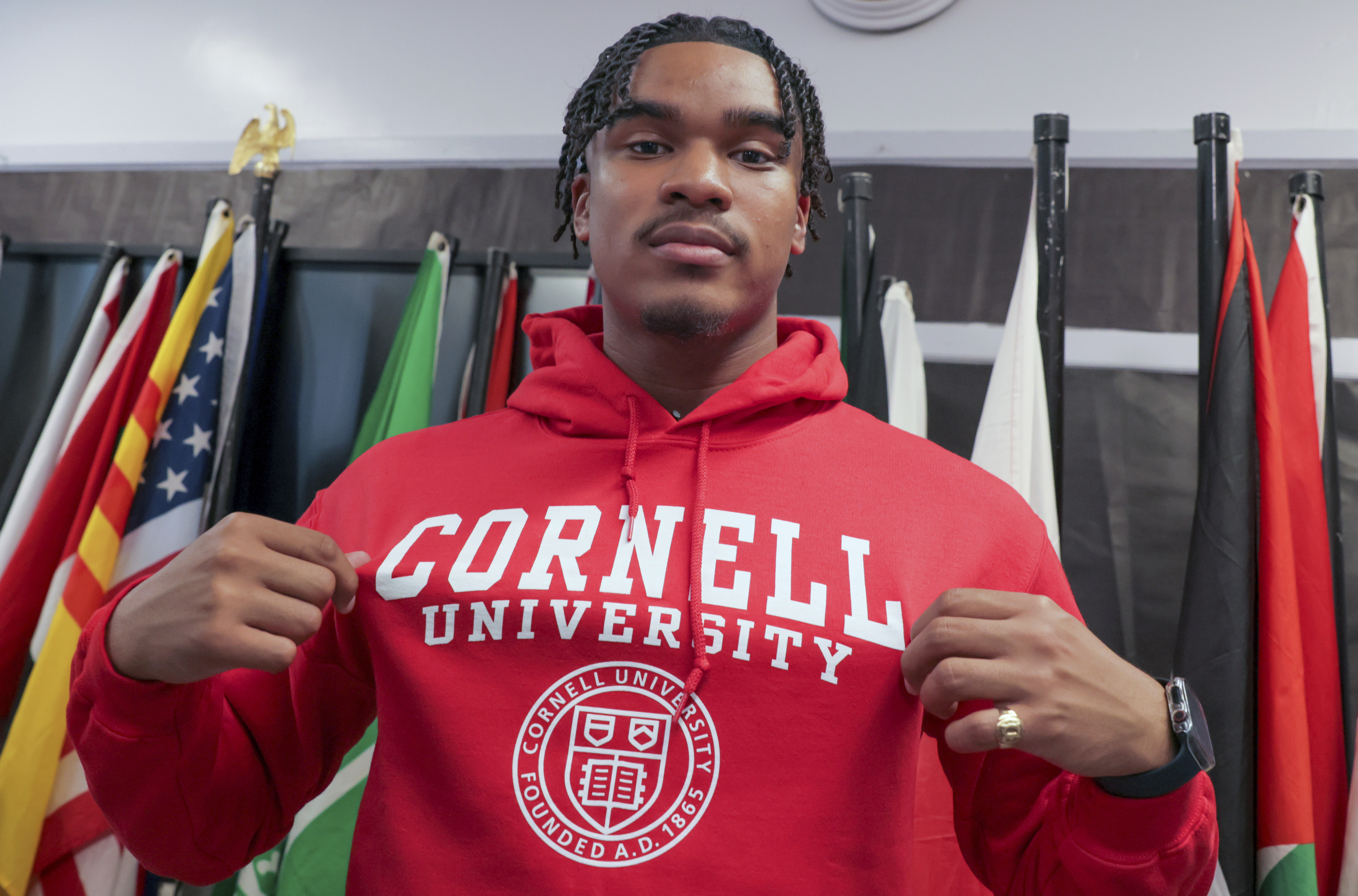 Dennis "Maliq" Barnes, 16, announces that he will be attending Cornell University during a news conference at International High School of New Orleans Friday, May 5, 2023. Barnes received more than 180 college acceptance letters and nabbed more than $10 million in scholarship offers, a new national record that brought international media attention. He will be enrolling in the college of engineering in the fall. (David Grunfeld, NOLA.com/The Times-Picayune/The New Orleans Advocate via AP)