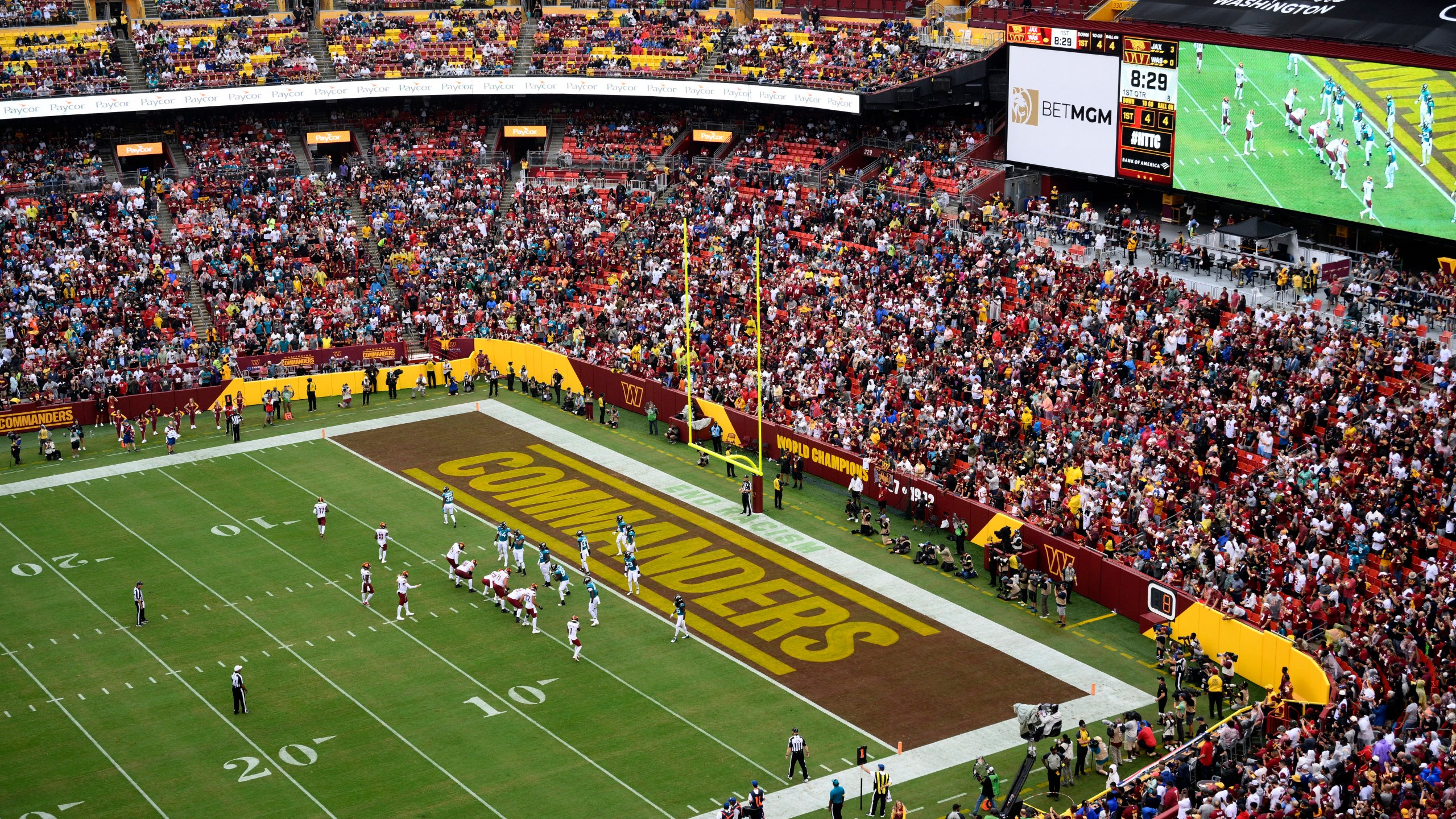 FILE - Fans watch as the Washington Commanders face the Jacksonville Jaguars in an NFL football game, Sunday, Sept. 11, 2022, in Landover, Md. A group led by Josh Harris and Mitchell Rales that includes Magic Johnson has an agreement in principle to buy the NFL's Washington Commanders from longtime owner Dan Snyder for a North American professional sports team record $6 billion, according to a person with knowledge of the situation. The person spoke to The Associated Press on condition of anonymity Thursday, April 13, 2023, because the deal had not been announced. (AP Photo/Nick Wass, File)