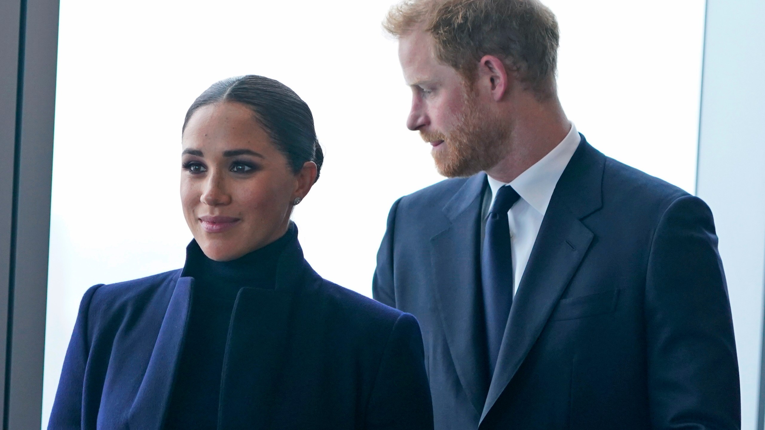 FILE - Meghan Markle, and her husband Prince Harry arrive to the observatory in One World Trade in New York, Thursday, Sept. 23, 2021. After months of speculation about whether they would be invited to the coronation, the palace announced that Harry would attend but Meghan would remain in California with their two children. (AP Photo/Seth Wenig, File)