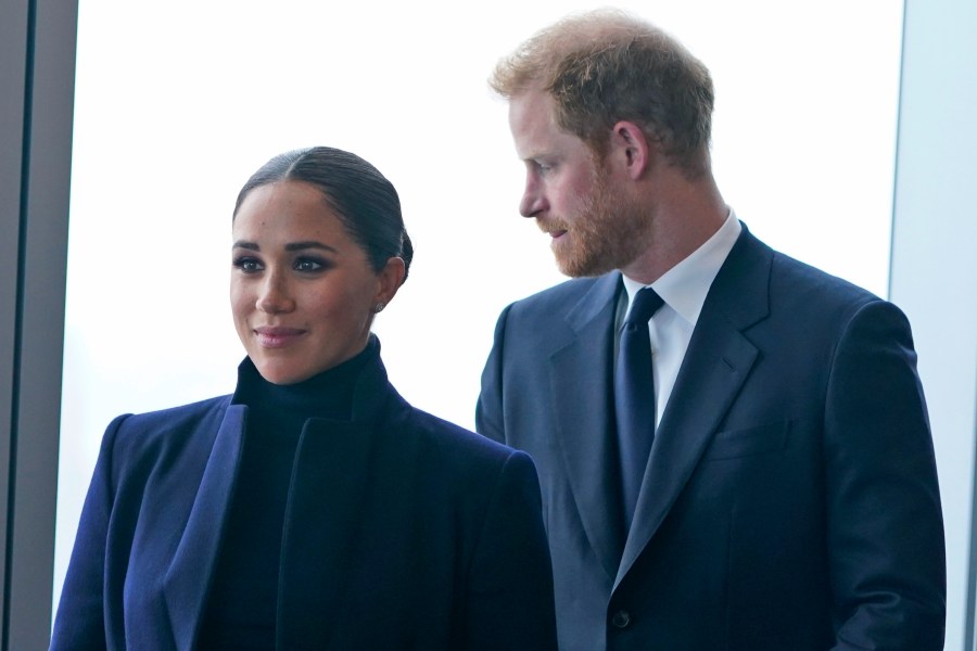 FILE - Meghan Markle, and her husband Prince Harry arrive to the observatory in One World Trade in New York, Thursday, Sept. 23, 2021. After months of speculation about whether they would be invited to the coronation, the palace announced that Harry would attend but Meghan would remain in California with their two children. (AP Photo/Seth Wenig, File)