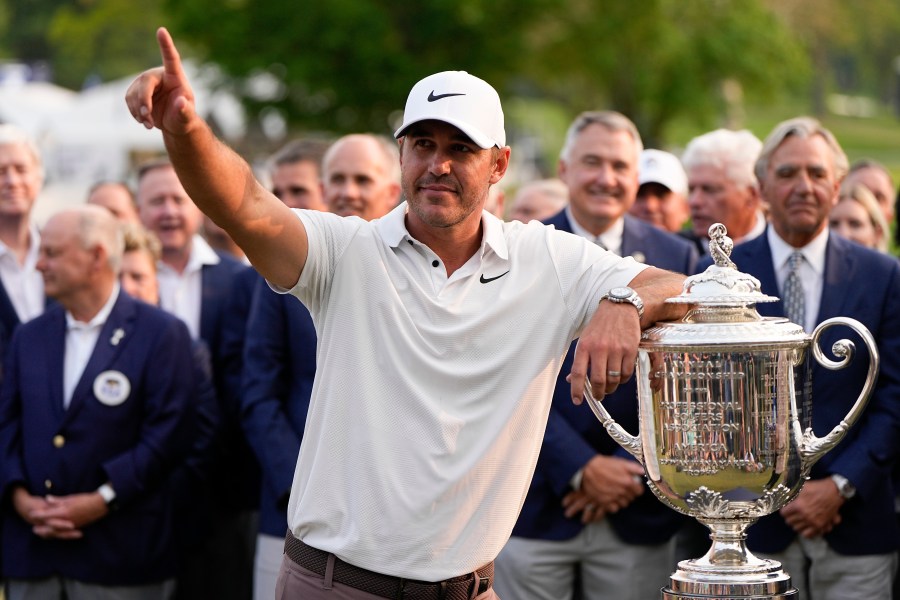 Brooks Koepka celebrates with the Wanamaker trophy after winning the PGA Championship golf tournament at Oak Hill Country Club on Sunday, May 21, 2023, in Pittsford, N.Y.(AP Photo/Eric Gay)