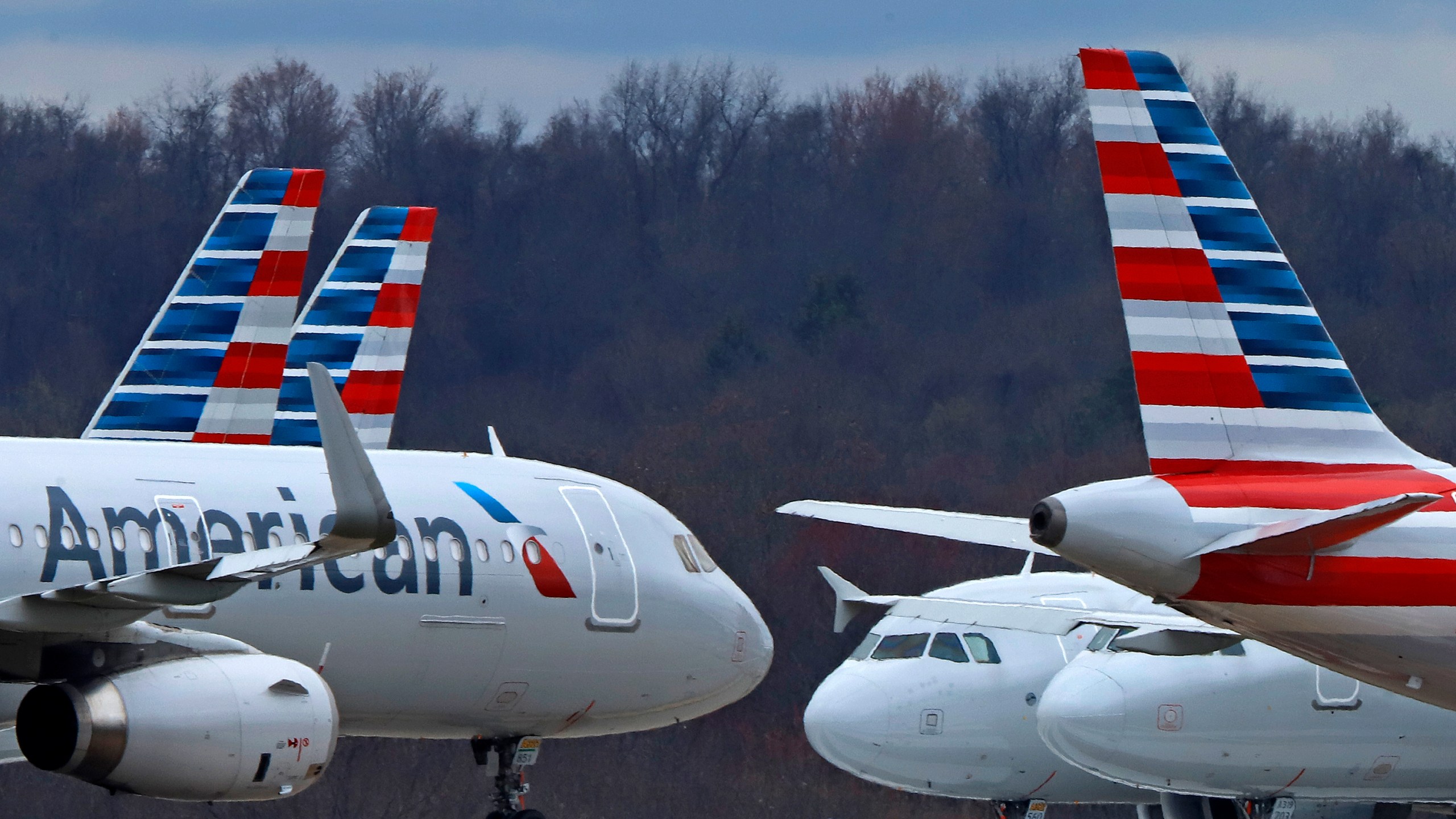 FILE - American Airlines planes are parked at Pittsburgh International Airport on March 31, 2020, in Imperial, Pa. American Airlines has reached a tentative labor agreement with pilots who recently raised the possibility of a strike against the nation’s biggest airline if they were unable to get a new contract with higher pay. American said Friday, May 19, 2023, that the four-year deal, if ratified by pilots, would give them pay and profit-sharing “that match the top of the industry.” (AP Photo/Gene J. Puskar, file)