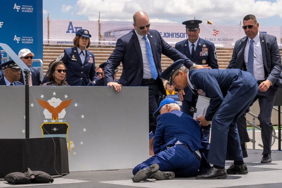 President Joe Biden falls on stage during the 2023 United States Air Force Academy Graduation Ceremony at Falcon Stadium, Thursday, June 1, 2023, at the United States Air Force Academy in Colorado Springs, Colo. (AP Photo/Andrew Harnik)