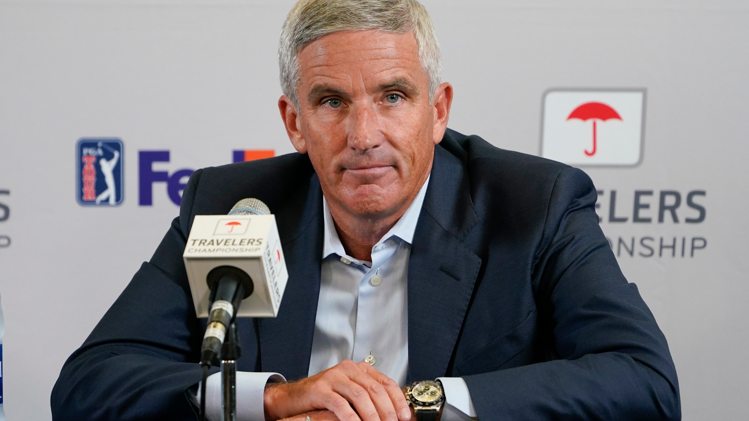 FILE - PGA Tour Commissioner Jay Monahan speaks during a news conference before the start of the Travelers Championship golf tournament at TPC River Highlands, Wednesday, June 22, 2022, in Cromwell, Conn. The most disruptive year in golf ended Tuesday, June 6, 2023, when the PGA Tour and European tour agreed to a merger with Saudi Arabia's golf interests, creating a commercial operation designed to unify professional golf around the world.(AP Photo/Seth Wenig, File)