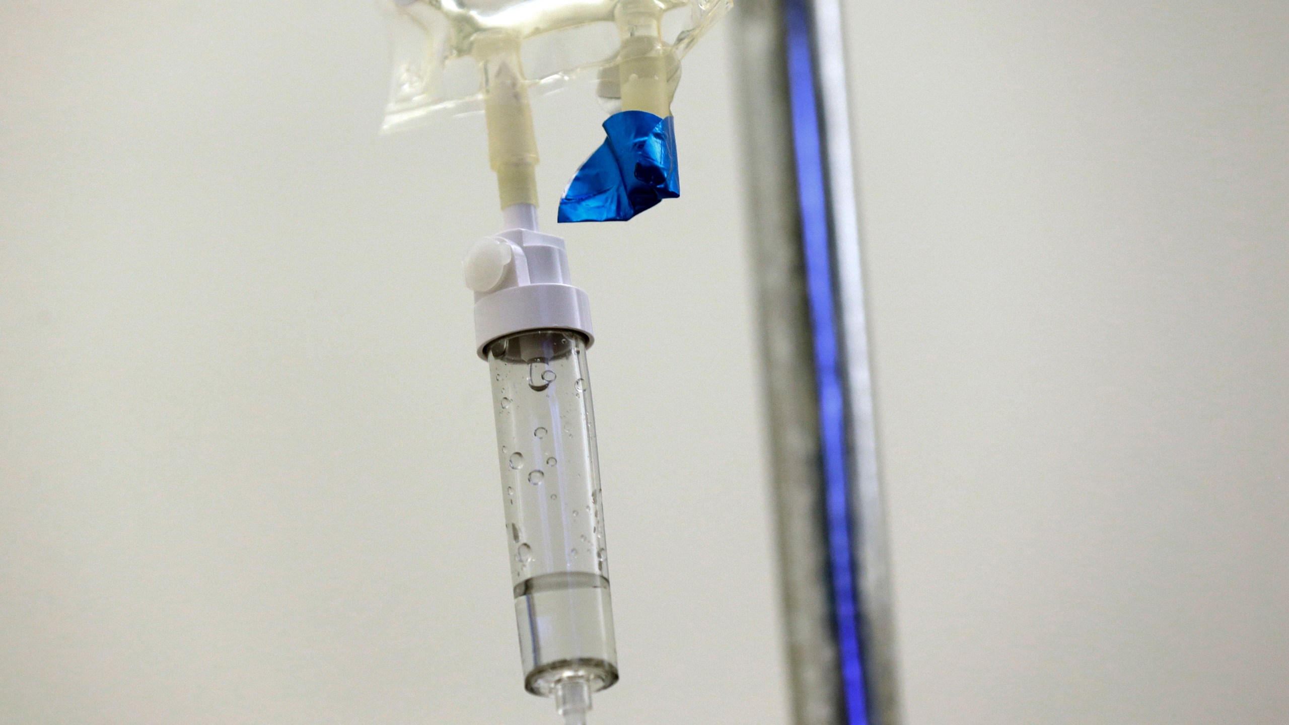 FILE - In this May 25, 2017 file photo, chemotherapy drugs are administered to a patient at a hospital in Chapel Hill, N.C. A growing shortage of common cancer treatments is forcing doctors to switch medications and delaying care, prominent U.S. cancer centers say. The National Comprehensive Cancer Network said Wednesday, June 7, 2023, that nearly all the centers it surveyed in late May 2023 were dealing with shortages of the chemotherapies carboplatin and cisplatin. (AP Photo/Gerry Broome)