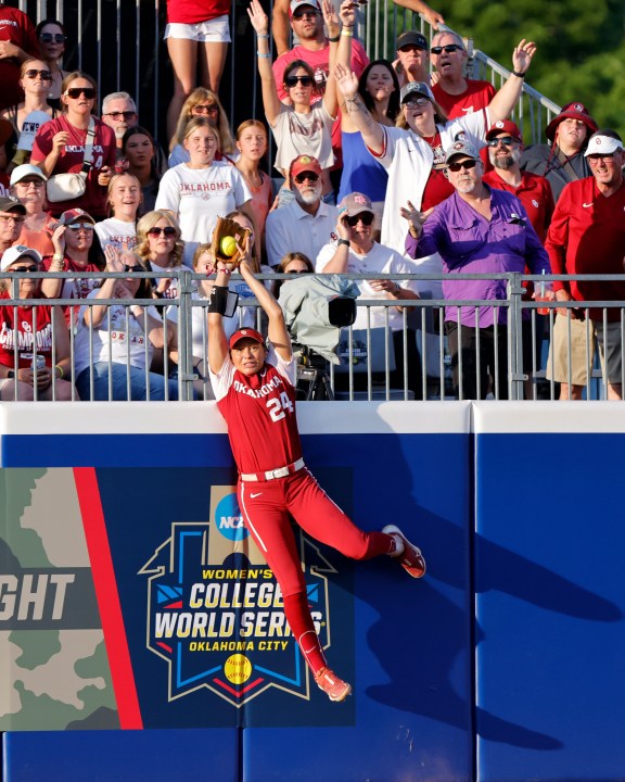 Oklahoma's Jayda Coleman catches a fly ball hit by Florida State's Kalei Harding during the third inning of the second game of the NCAA Women's College World Series softball championship series Thursday, June 8, 2023, in Oklahoma City. (AP Photo/Nate Billings)