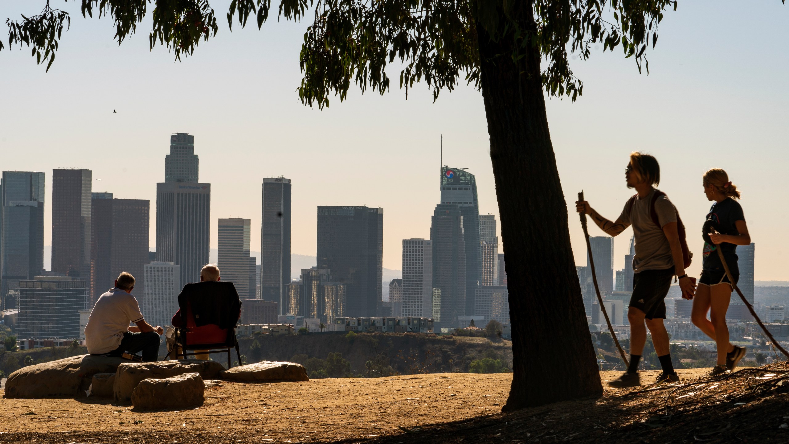 FILE - Albert Maghbouleh, far left, and Miles Santamour, 89, with Amigos de Jaibalito Foundation (ADJ) share lunch outdoors guarding social distancing, overlooking the skyline of Los Angeles on Jan. 11, 2021. America got older last decade. The share of seniors age 65 or older in the U.S. grew by more than a third, while the share of children declined, particularly among those under age 5, according to new figures from the 2020 census released Thursday, May 25, 2023. (AP Photo/Damian Dovarganes, File)