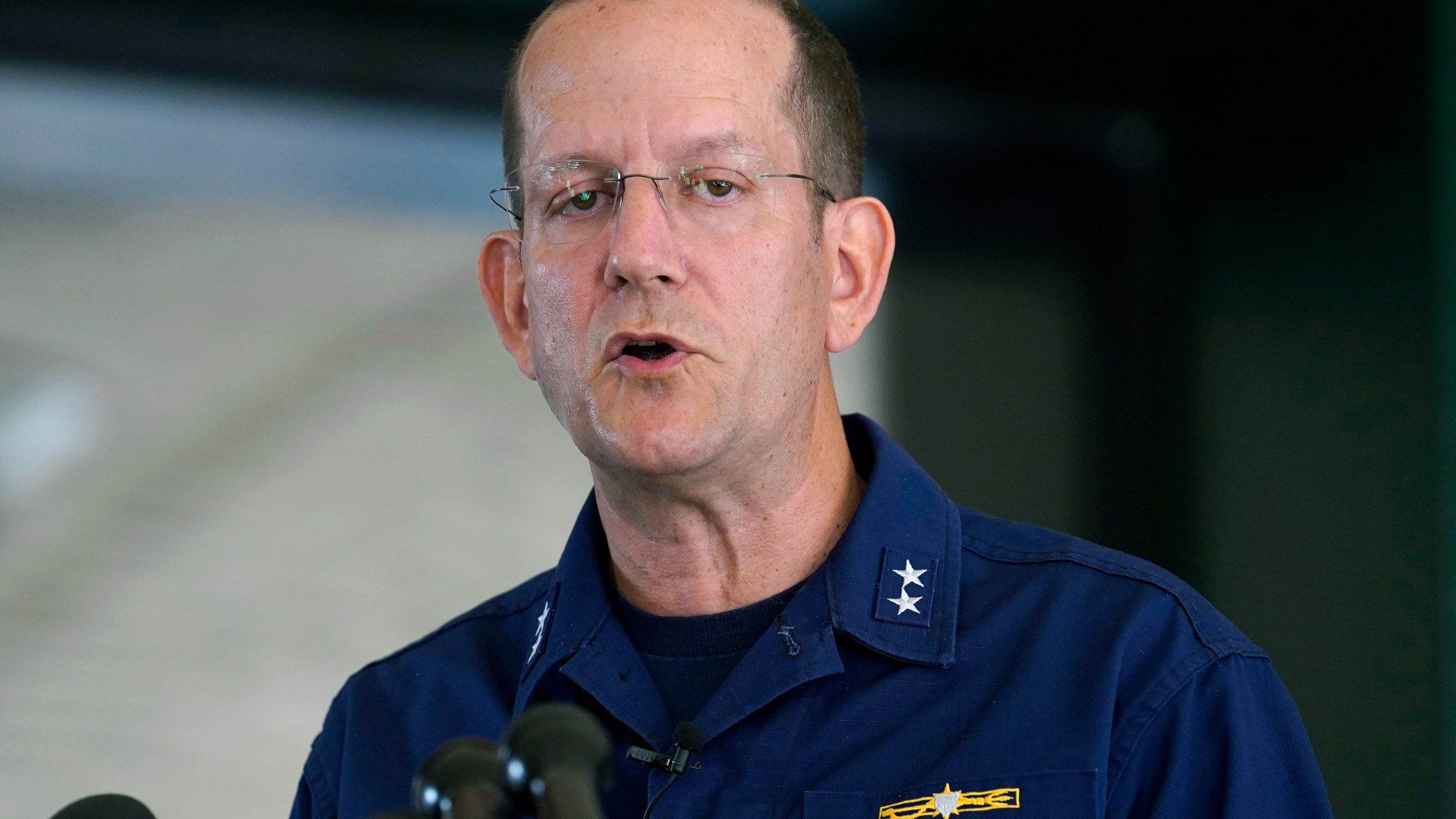 U.S. Coast Guard Rear Adm. John Mauger, commander of the First Coast Guard District, speaks to the media, Monday, June 19, 2023, in Boston. A search is underway for a missing submersible that carries people to view the wreckage of the Titanic. Canadian officials say the five-person submersible was reported overdue Sunday night about 435 miles (700 kilometers) south of St. John's, Newfoundland and that the search is being led by the U.S. Coast Guard. (AP Photo/Steven Senne)