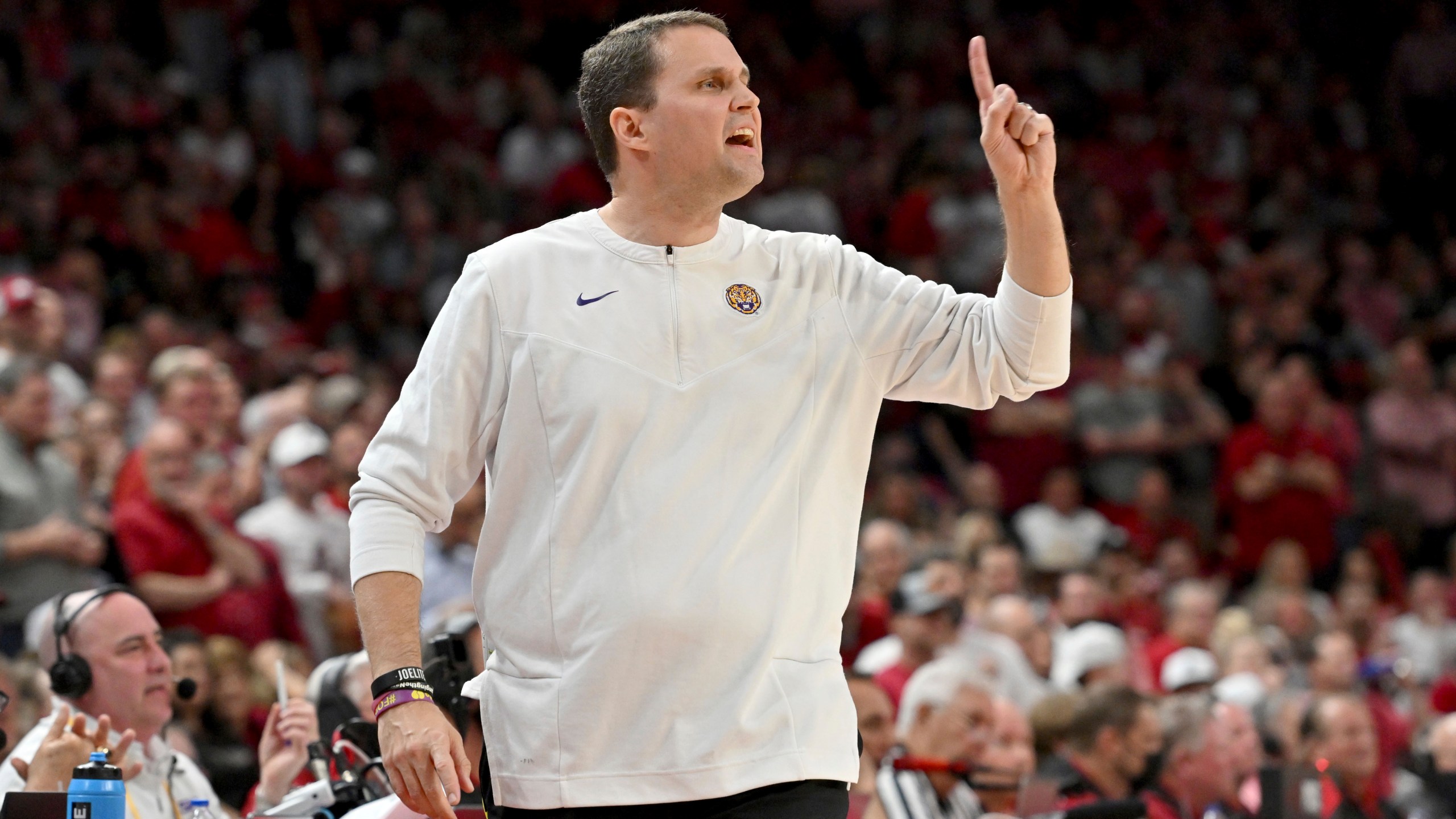 FILE - Then-LSU coach Will Wade gestures during the first half of an NCAA college basketball game against Arkansas, Wednesday, March 2, 2022, in Fayetteville, Ark. An independent infractions panel handed a two-year show-cause penalty and a 10-game suspension to former LSU and current McNeese State men's basketball coach Will Wade on Thursday, June 22, 2023, for multiple rules violations. (AP Photo/Michael Woods, File)