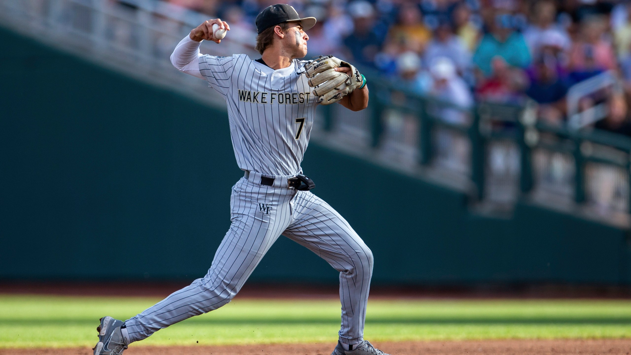 Wake Forest shortstop Marek Houston throws to first for an out against LSU duirng the second inning of a baseball game at the NCAA College World Series in Omaha, Neb., Thursday, June 22, 2023. (AP Photo/John Peterson)