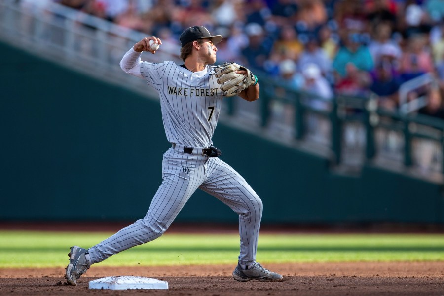 Wake Forest shortstop Marek Houston throws to first for an out against LSU duirng the second inning of a baseball game at the NCAA College World Series in Omaha, Neb., Thursday, June 22, 2023. (AP Photo/John Peterson)