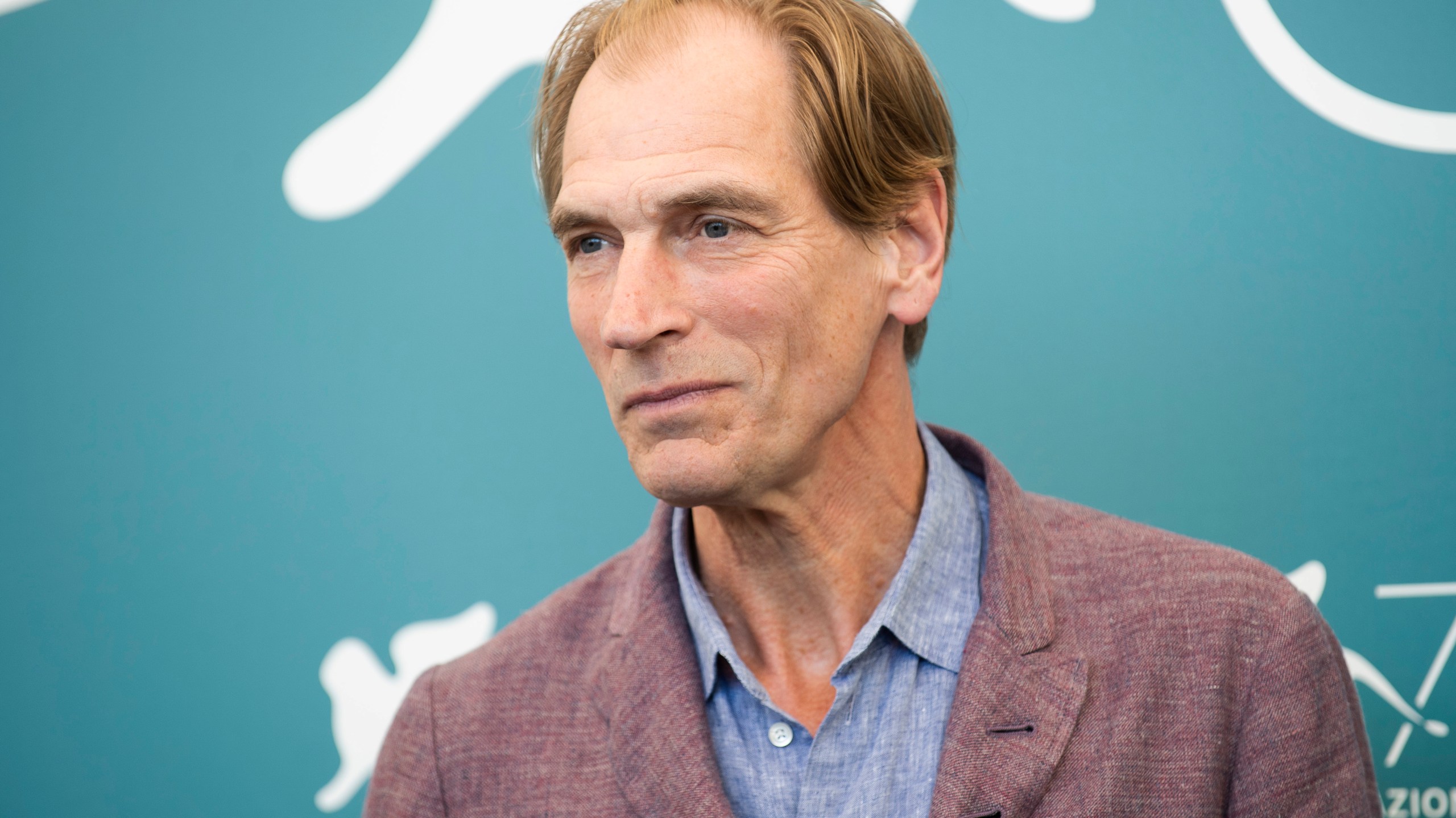 FILE - Actor Julian Sands poses for photographers at the Venice Film Festival in Venice, Italy, on Sept. 3, 2019. Authorities say the latest search for missing actor Julian Sands on Southern California's massive Mount Baldy was unsuccessful. Sands was reported missing in January 2023 after setting out to hike on Mount Baldy, which rises more than 10,000 feet east of Los Angeles and was pounded by severe winter storms. (Photo by Arthur Mola/Invision/AP, File)