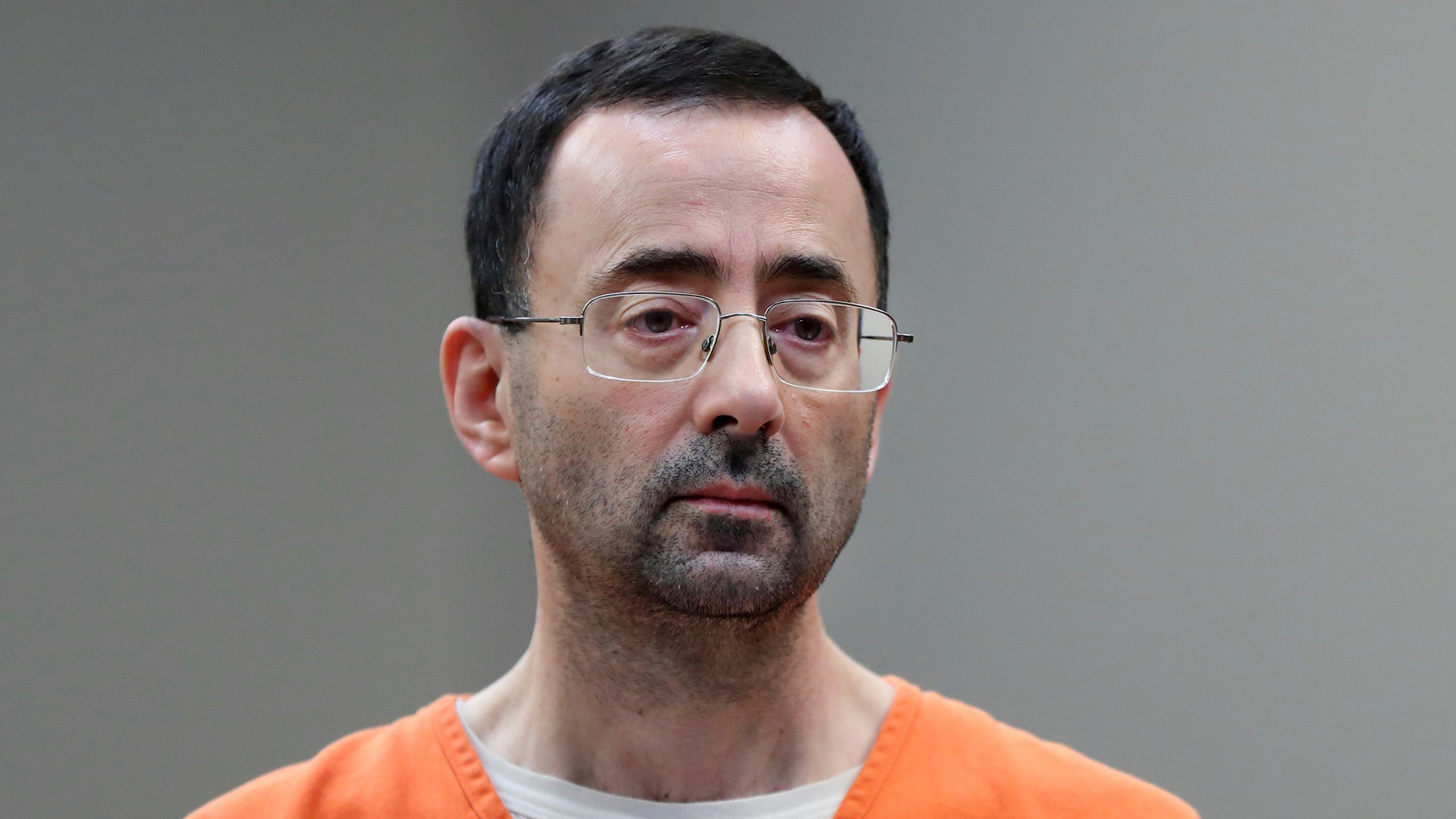 FILE - In this Nov. 22, 2017 file photo, Dr. Larry Nassar appears in court for a plea hearing in Lansing, Mich. Nassar, who was convicted of sexually abusing female gymnasts, was stabbed multiple times during an altercation with another incarcerated person at a federal prison in Florida. Two people familiar with the matter told The Associated Press the attack happened Sunday at United States Penitentiary Coleman in Florida. The people said he was in stable condition Monday. (AP Photo/Paul Sancya, File)