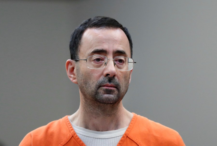 FILE - In this Nov. 22, 2017 file photo, Dr. Larry Nassar appears in court for a plea hearing in Lansing, Mich. Nassar, who was convicted of sexually abusing female gymnasts, was stabbed multiple times during an altercation with another incarcerated person at a federal prison in Florida. Two people familiar with the matter told The Associated Press the attack happened Sunday at United States Penitentiary Coleman in Florida. The people said he was in stable condition Monday. (AP Photo/Paul Sancya, File)