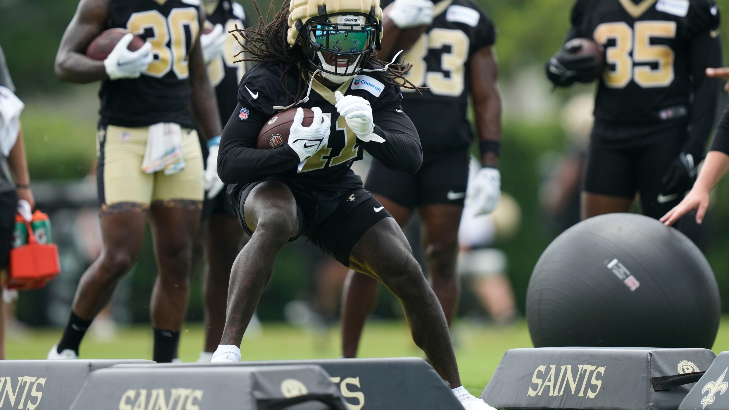 New Orleans Saints running back Alvin Kamara (41) runs through drills at the team's NFL football minicamp in Metairie, La., Thursday, June 15, 2023. (AP Photo/Gerald Herbert)