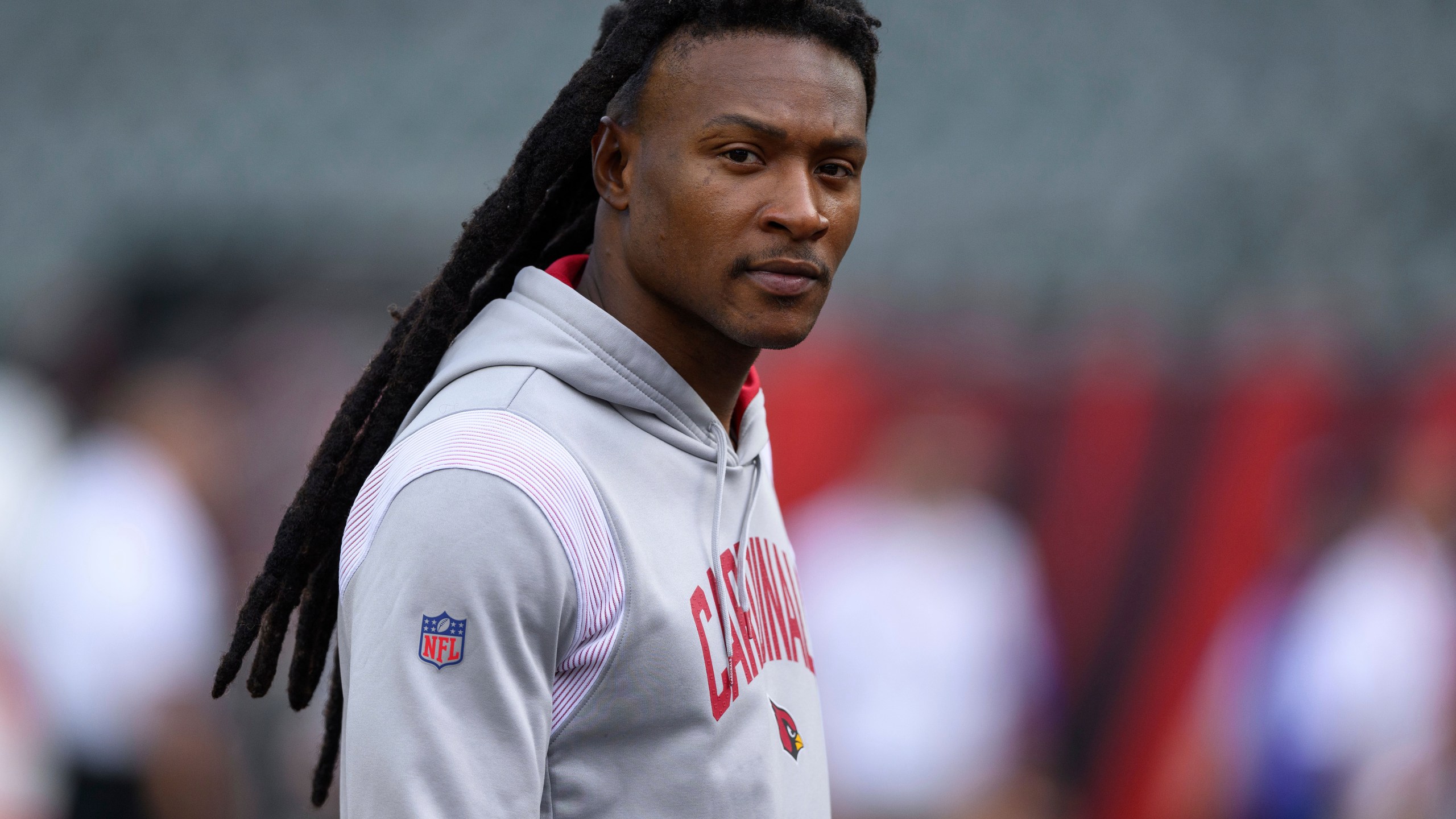 FILE - Arizona Cardinals wide receiver DeAndre Hopkins walks on the field before an NFL football game against the Cincinnati Bengals, Aug. 12, 2022, in Cincinnati. The Tennessee Titans hope they have filled their major need at wide receiver with three-time All-Pro wide receiver Hopkins by agreeing to terms on a two-year deal worth $26 million with incentives that could push that to $32 million, a person familiar with the agreement said Sunday, July 16, 2023. (AP Photo/Zach Bolinger, File)