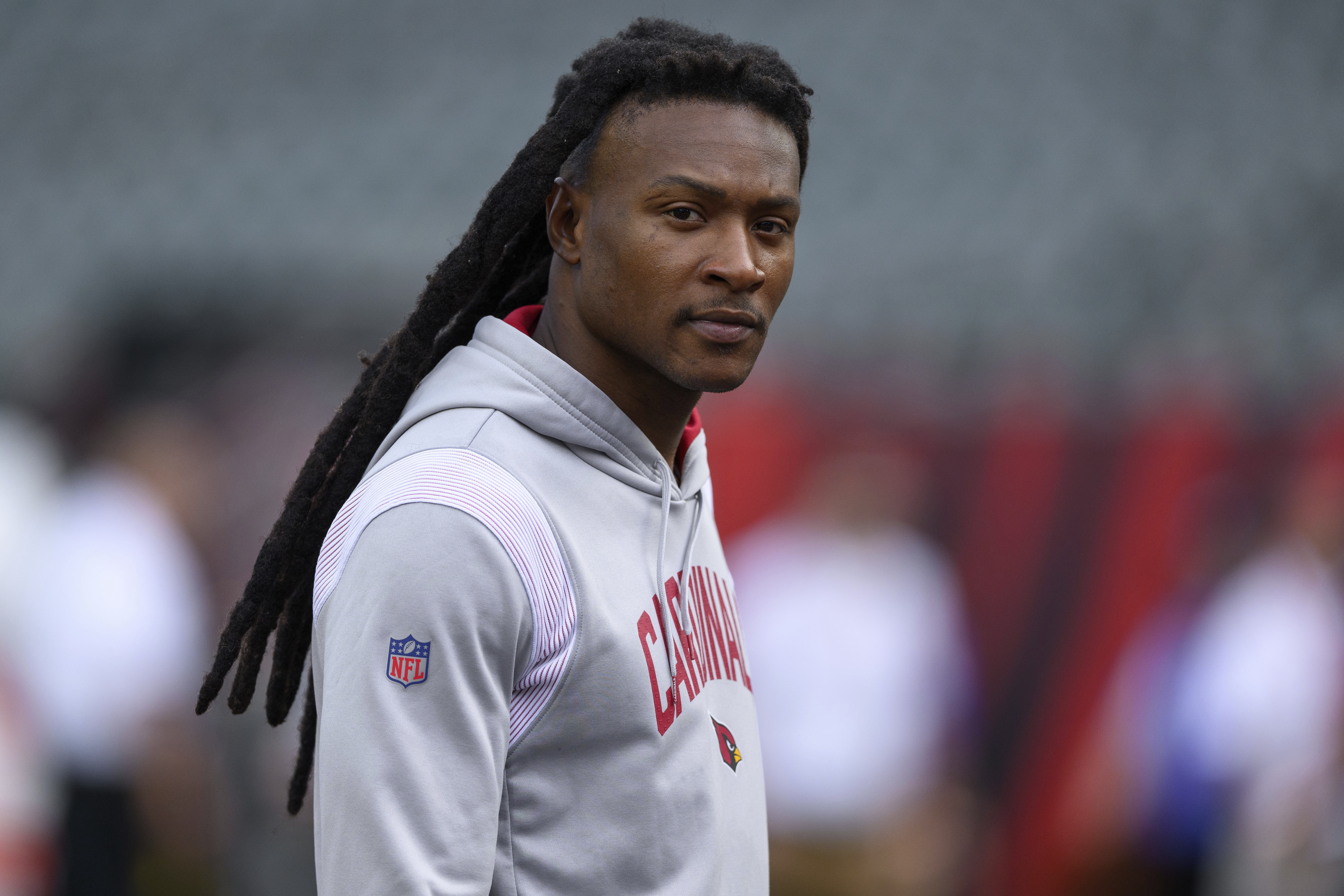 FILE - Arizona Cardinals wide receiver DeAndre Hopkins walks on the field before an NFL football game against the Cincinnati Bengals, Aug. 12, 2022, in Cincinnati. The Tennessee Titans hope they have filled their major need at wide receiver with three-time All-Pro wide receiver Hopkins by agreeing to terms on a two-year deal worth $26 million with incentives that could push that to $32 million, a person familiar with the agreement said Sunday, July 16, 2023. (AP Photo/Zach Bolinger, File)