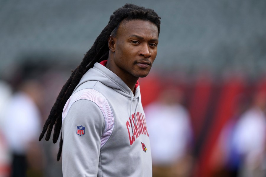 FILE - Arizona Cardinals wide receiver DeAndre Hopkins walks on the field before an NFL football game against the Cincinnati Bengals, Aug. 12, 2022, in Cincinnati. The Tennessee Titans hope they have filled their major need at wide receiver with three-time All-Pro wide receiver Hopkins by agreeing to terms on a two-year deal worth $26 million with incentives that could push that to $32 million, a person familiar with the agreement said Sunday, July 16, 2023. (AP Photo/Zach Bolinger, File)