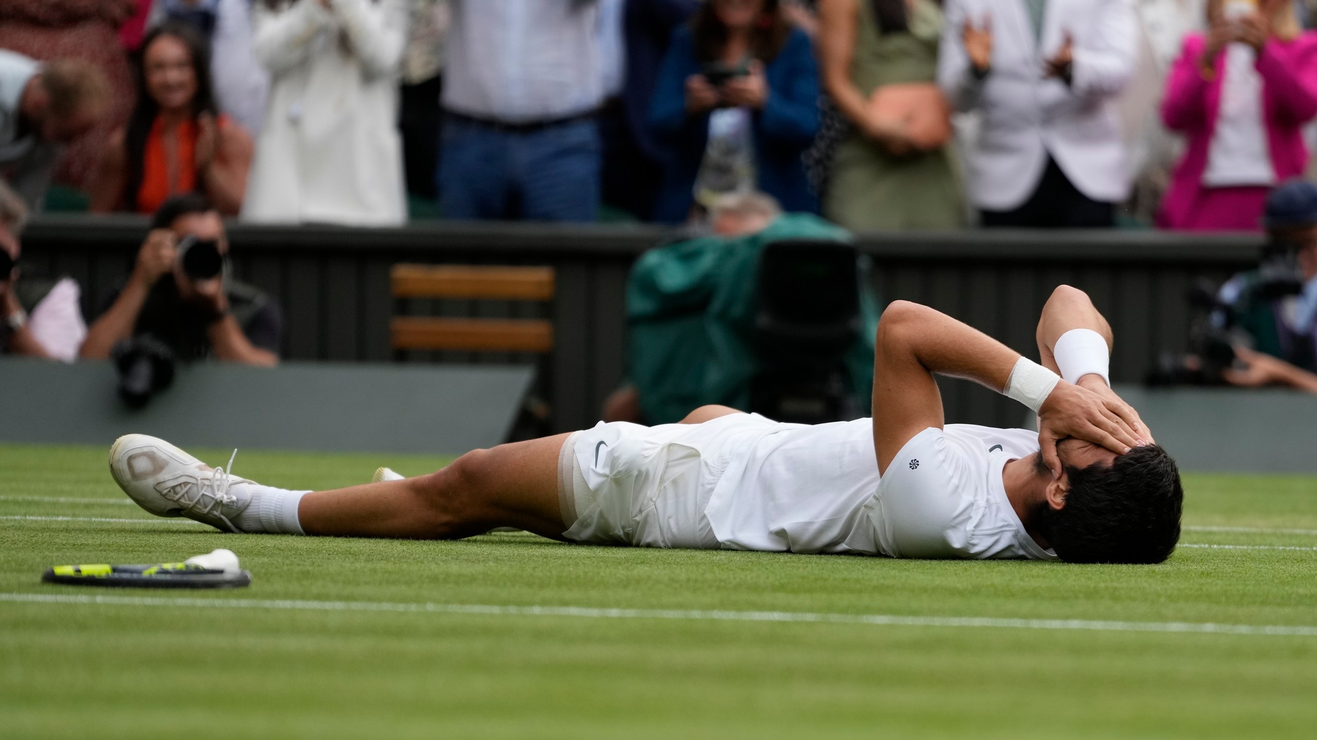 Spain's Carlos Alcaraz celebrates after beating Serbia's Novak Djokovic to win the final of the men's singles on day fourteen of the Wimbledon tennis championships in London, Sunday, July 16, 2023. (AP Photo/Kirsty Wigglesworth)