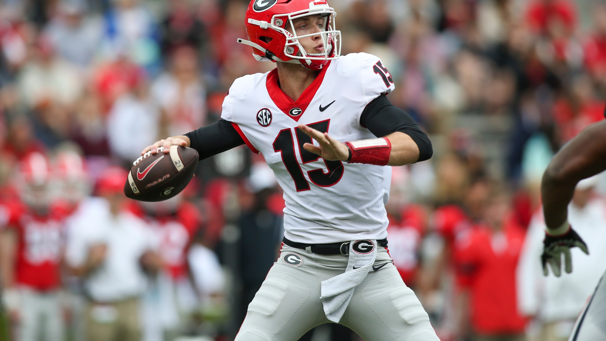 FILE - Georgia quarterback Carson Beck (15) throws in the first half of Georgia's spring NCAA college football game, Saturday, April 16, 2022, in Athens, Ga. Coach Kirby Smart has made it clear that Carson Beck is the quarterback to beat. (AP Photo/Brett Davis, File)