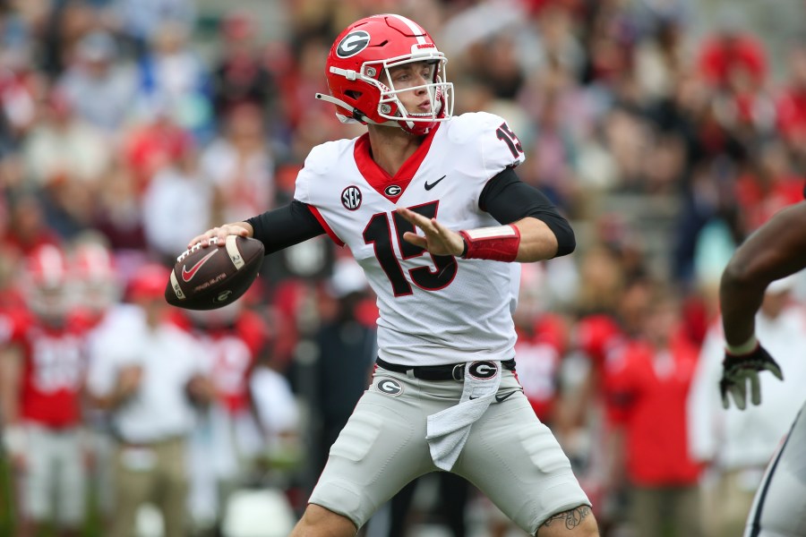 FILE - Georgia quarterback Carson Beck (15) throws in the first half of Georgia's spring NCAA college football game, Saturday, April 16, 2022, in Athens, Ga. Coach Kirby Smart has made it clear that Carson Beck is the quarterback to beat. (AP Photo/Brett Davis, File)