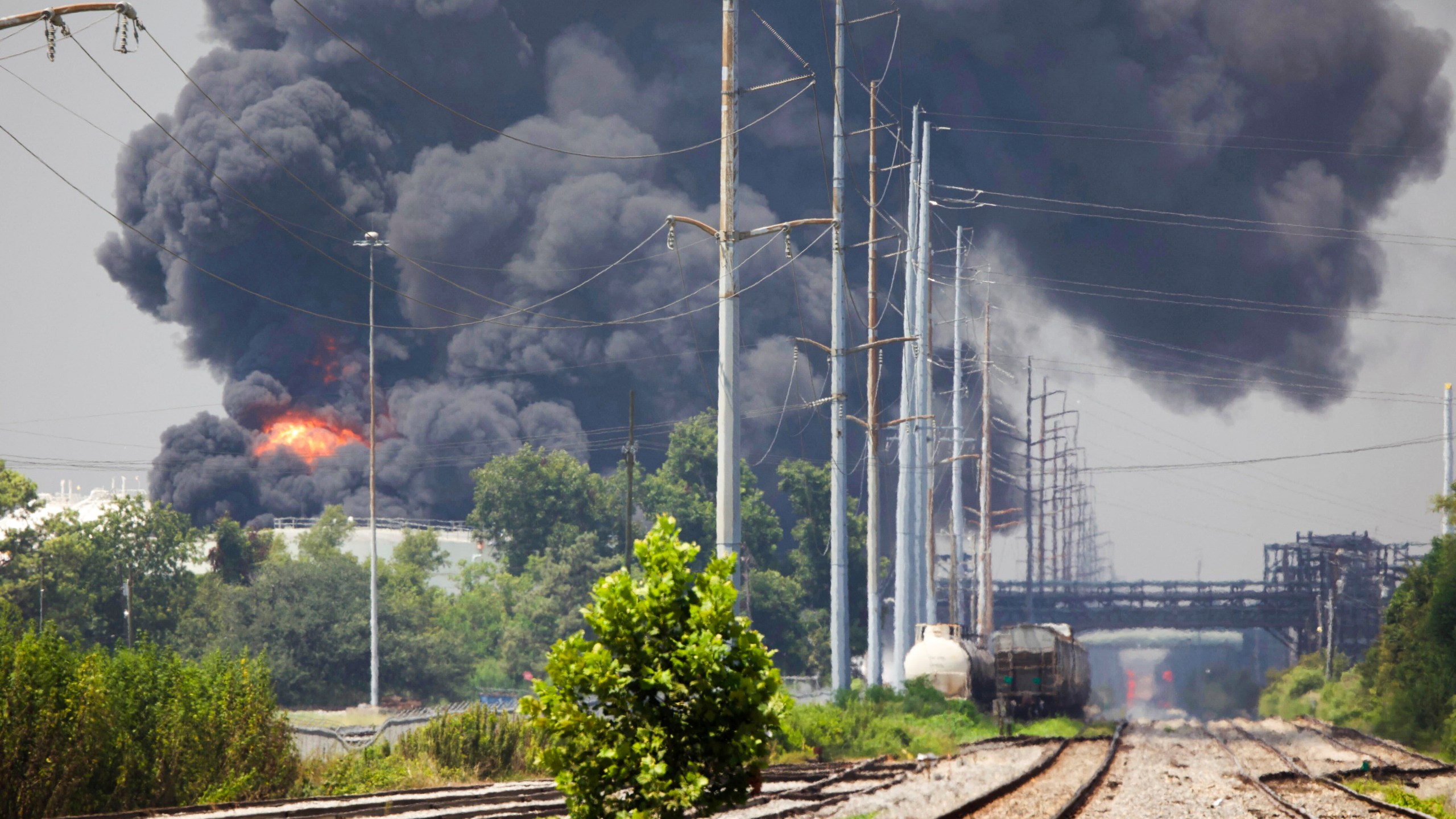 Smoke billows from a tank fire at the Marathon Petroleum facility in Garyville, La., Friday, Aug. 25, 2023. Garyville is located about 40 miles up the Mississippi River from New Orleans. (Chris Granger/The Times-Picayune/The New Orleans Advocate via AP)