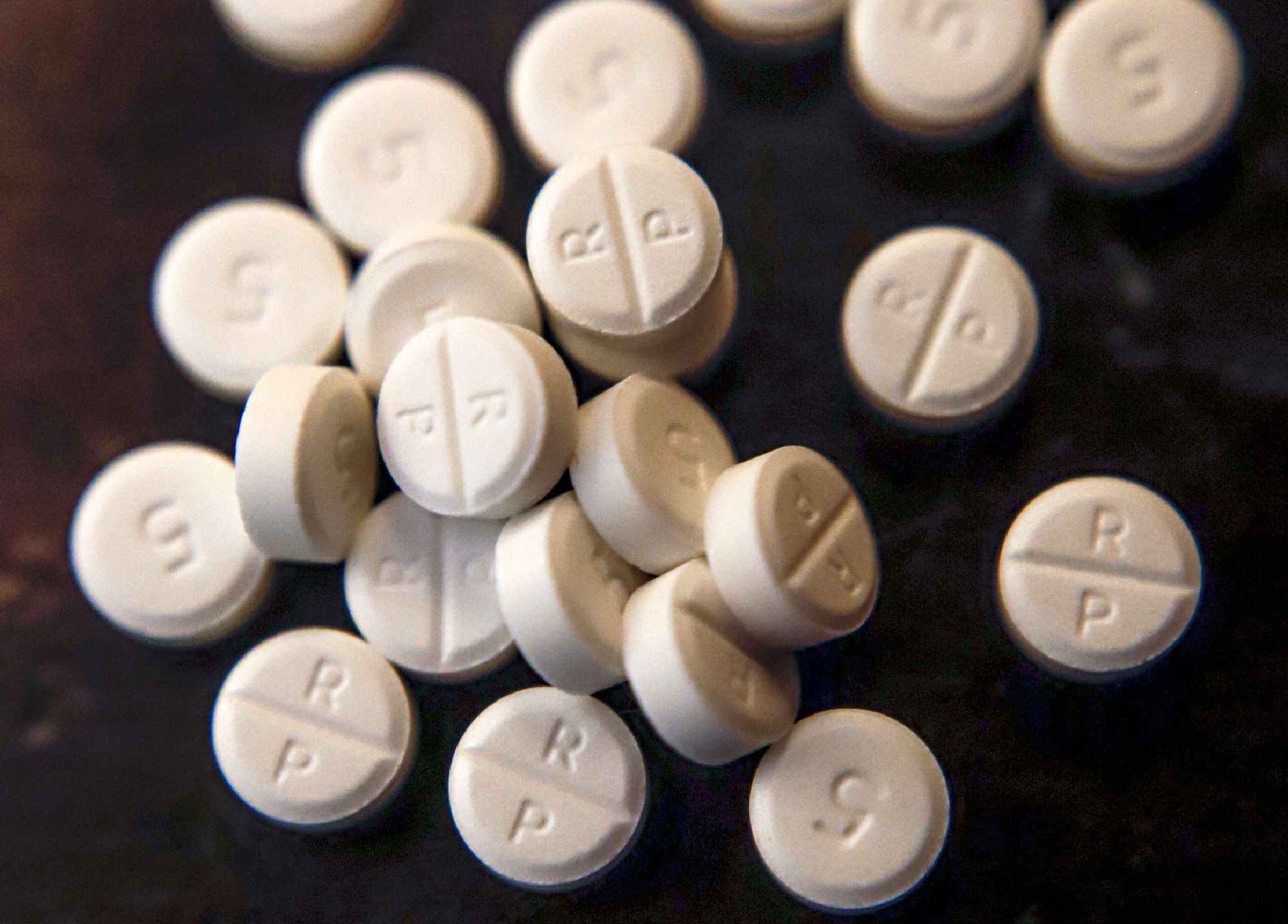 FILE - A number of 5-mg pills of Oxycodone are displayed on June 17, 2019. Data released Tuesday, Sept. 12, 2023, shows that the number of prescription pills shipped in the U.S. continued to decline through the end of the 2010s, even as the overdose crisis deepened due to illicit opioids. (AP Photo/Keith Srakocic, File)