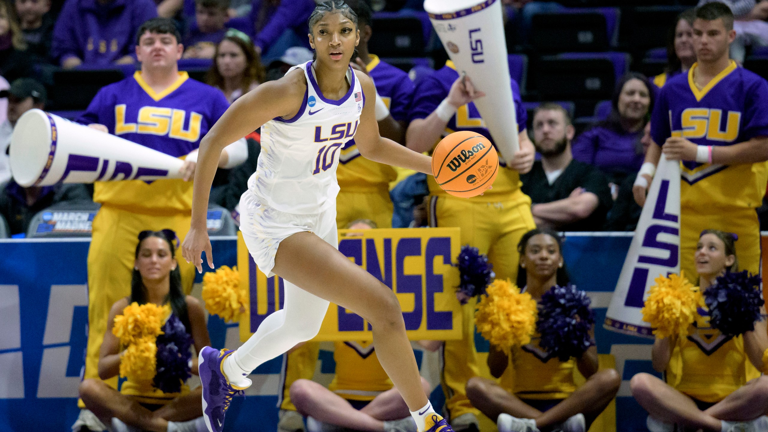 FILE - LSU forward Angel Reese (10) dribbles during a first-round college basketball game in the women's NCAA Tournament in Baton Rouge, La., Friday, March 17, 2023. Coming off the school's first NCAA women's basketball championship, LSU is ranked No. 1 in the AP Top 25 preseason women's basketball poll, released Tuesday, Oct. 17, 2023. There's clearly a lot of optimism around LSU as they return a stellar group, including Angel Reese and added two huge transfers with Hailey Van Lith and Aneesah Morrow.(AP Photo/Matthew Hinton, File)