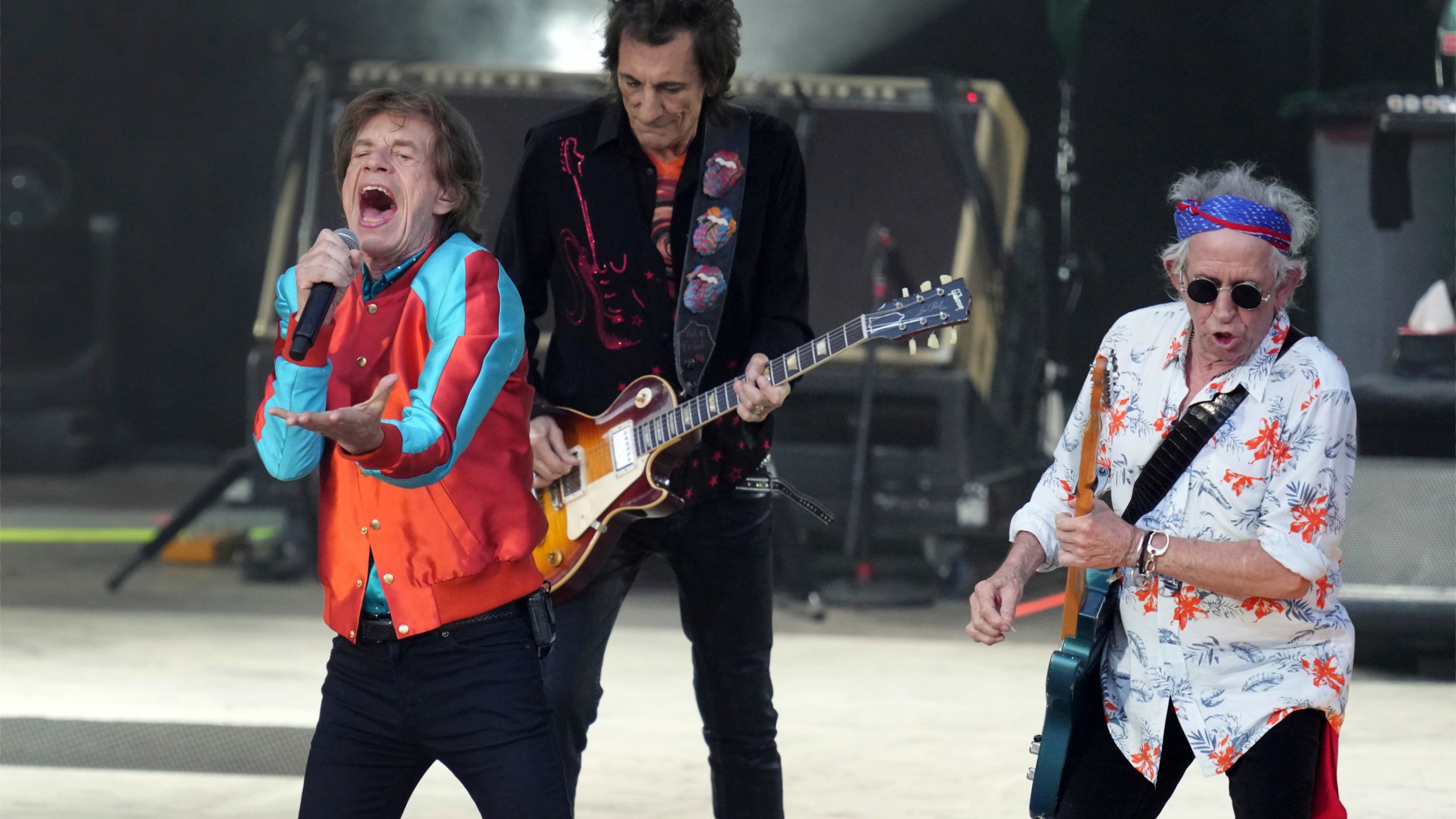 FILE - Mick Jagger, left, Ronnie Wood, center, and Keith Richards, right, of the band The Rolling Stones, perform during the last concert of their "Sixty" European tour, Aug. 3, 2022, in Berlin, Germany. On Tuesday, Nov. 21, 2023, the legendary English band announced that they're taking “Hackney Diamonds,” their first album of original material in 18 years, on the road. (AP Photo/Michael Sohn, File)