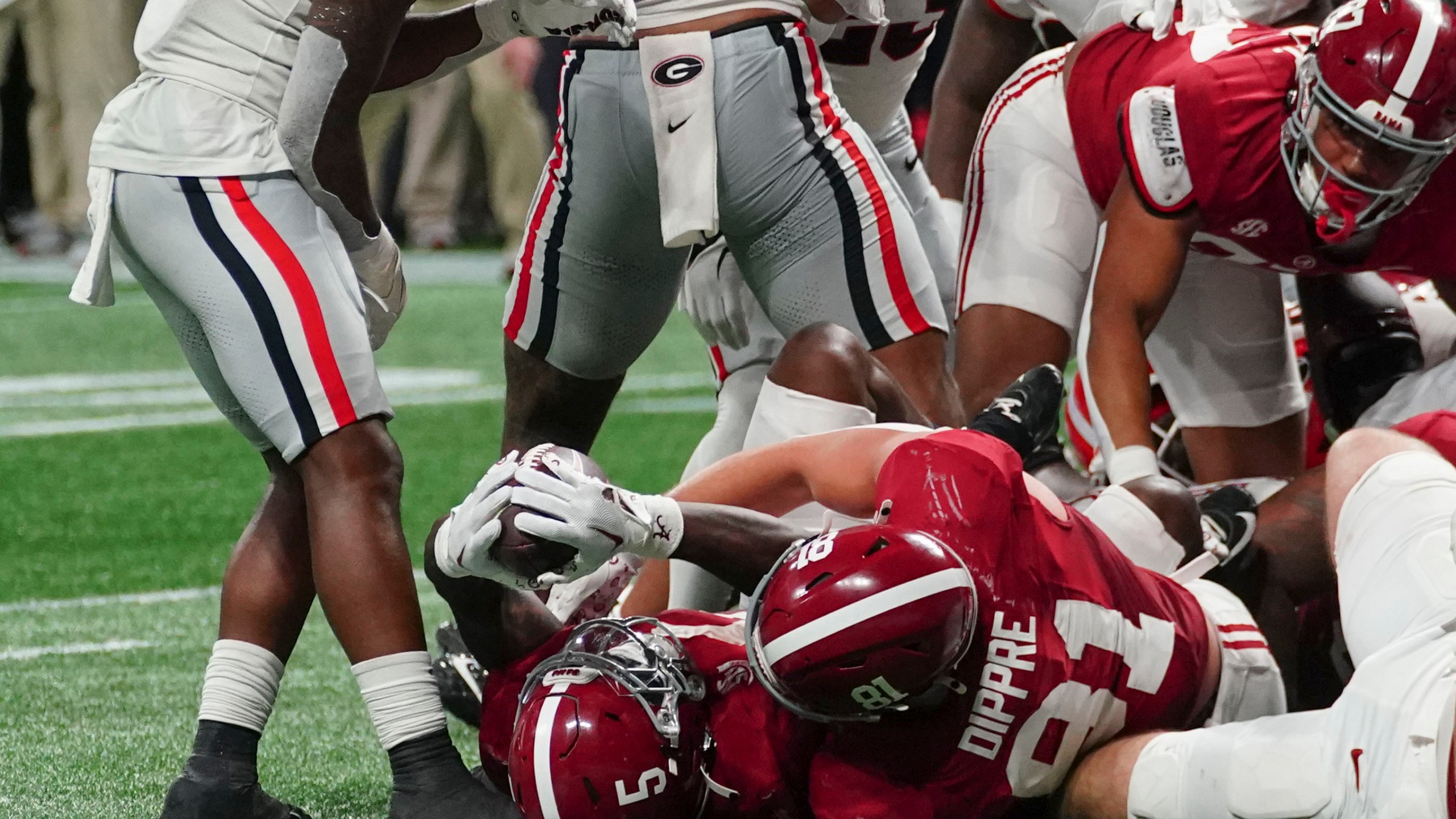 Alabama running back Roydell Williams (5) scores a touchdown during the second half of the Southeastern Conference championship NCAA college football game against Georgia in Atlanta, Saturday, Dec. 2, 2023. (AP Photo/John Bazemore)