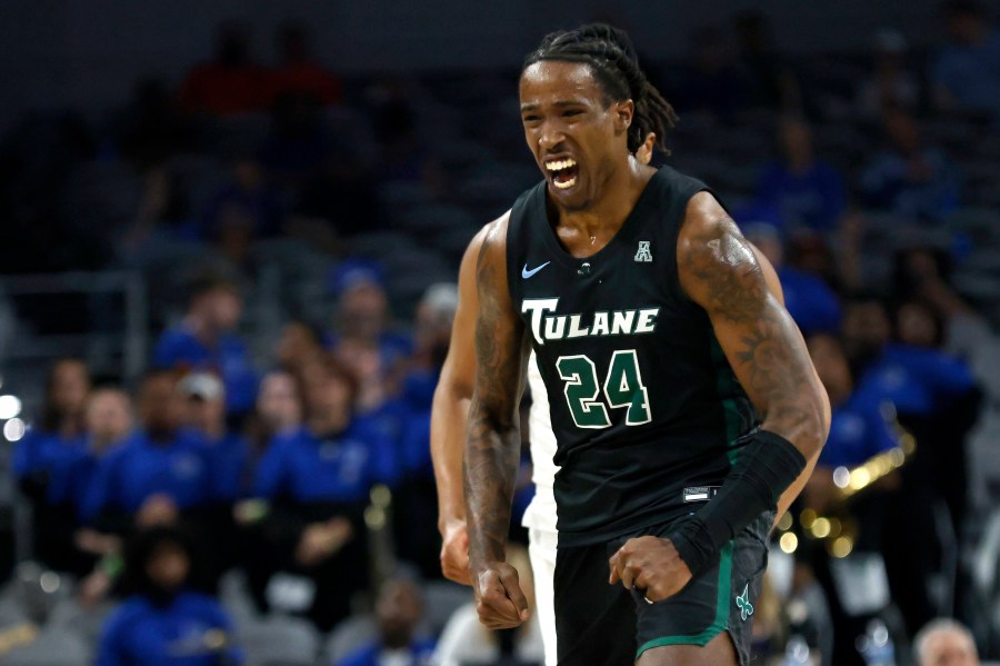 FILE - Tulane forward Kevin Cross (24) reacts after scoring a 3-point basket against Memphis during first half of an NCAA college basketball game in the semifinals of the American Athletic Conference Tournament, Saturday, March 11, 2023, in Fort Worth, Texas. Cross of Tulane is The Associated Press national player of the week after having consecutive triple-doubles against Furman and Southern last week. (AP Photo/Ron Jenkins, File)