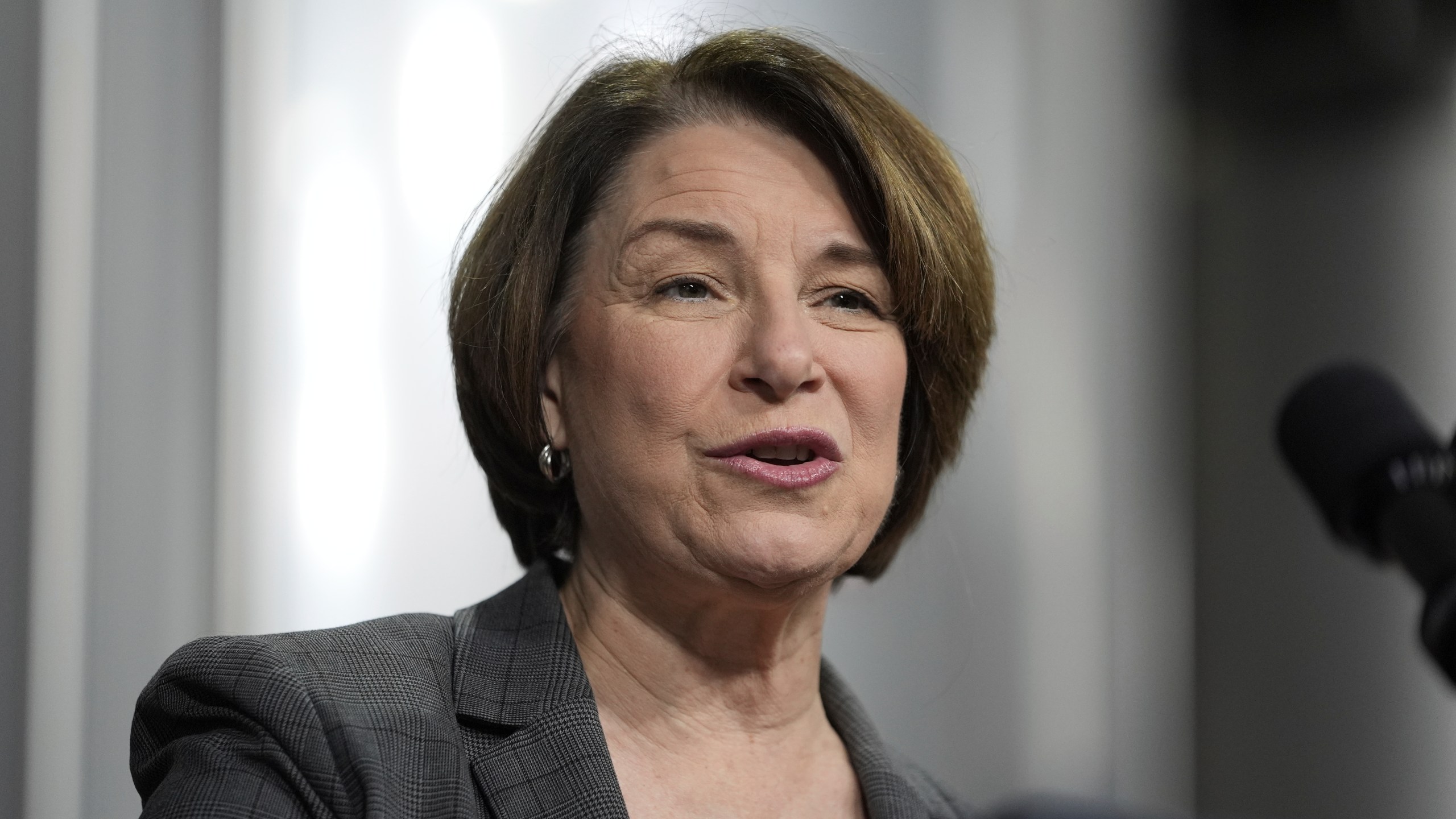 FILE - U.S. Sen. Amy Klobuchar, D-Minn., speaks before President Joe Biden at the Earth Rider Brewery, Jan. 25, 2024, in Superior, Wis. Klobuchar said Friday, July 12, that she remains cancer-free following her bout with breast cancer in 2021, but doctors recently removed a small calcification and that she'll get radiation treatment as a precaution. (AP Photo/Alex Brandon, File)