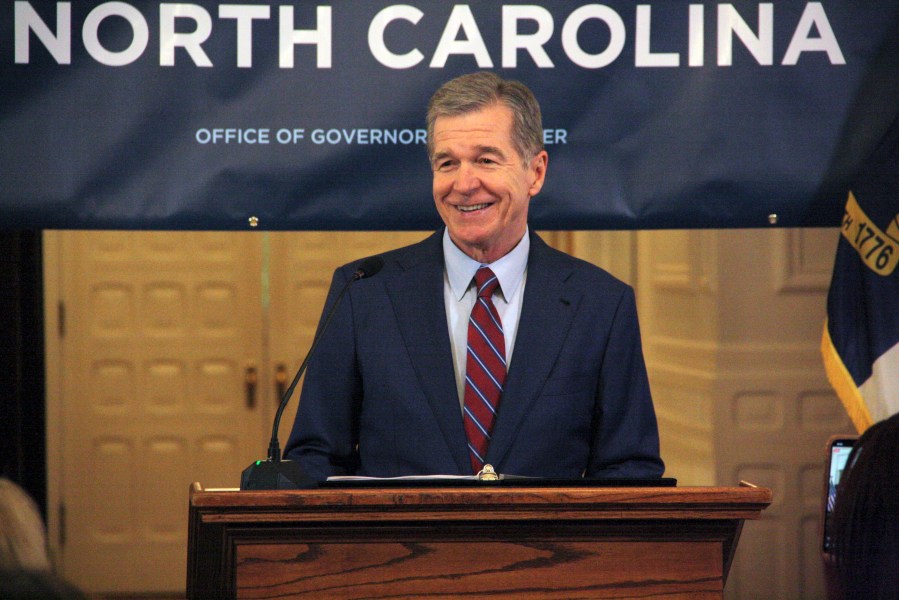 North Carolina Gov. Roy Cooper touts Medicaid expansion reaching 500,000 enrollees during a news conference at the North Carolina Executive Mansion in Raleigh, N.C., on Friday, July 12, 2024. It took about seven months to reach 500,000 enrollees, which Cooper said exceeded his office's expectations. (AP Photo/Makiya Seminera)