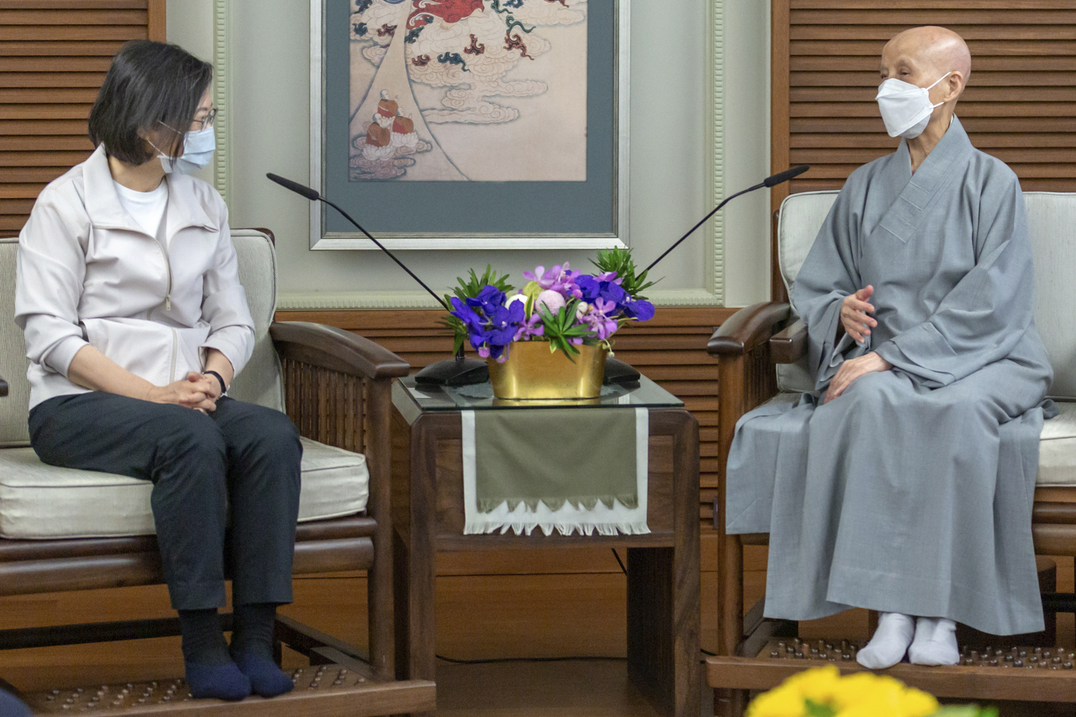 In this photo provided by the Taiwan Presidential Office, the then President of Taiwan Tsai Ing-wen meets with Cheng Yen in Hualien county, eastern Taiwan, Sept. 21, 2022. In 1966, Cheng Yen, a Buddhist nun living in eastern Taiwan, asked local housewives to contribute 50 cents a month to fund her charity. That grassroots effort grew into Tzu Chi, a global organization that responds to disasters and builds schools and hospitals around the world. (Taiwan Presidential Office via AP)