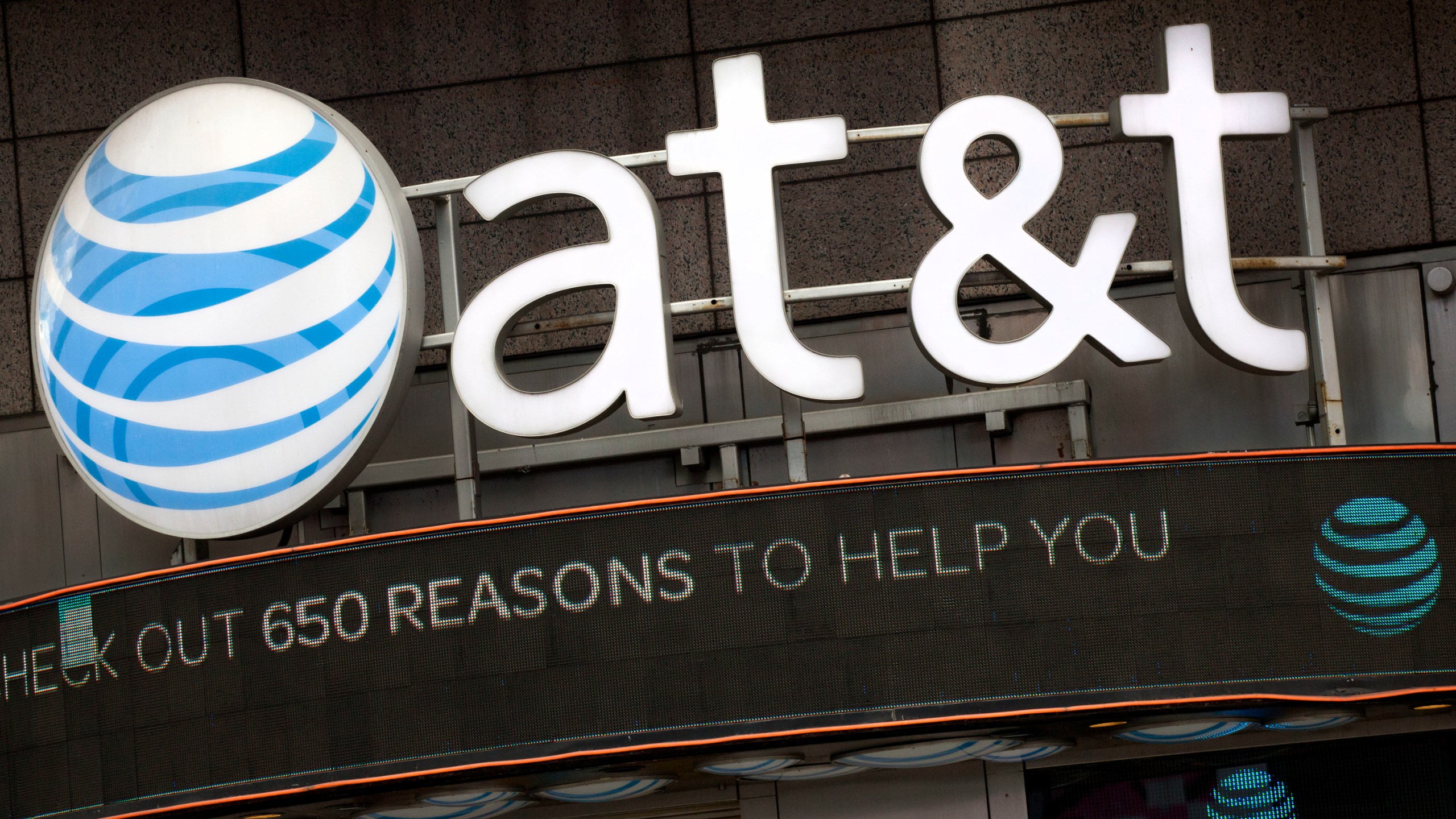 FILE - The AT&T logo is positioned above one of its retail stores in New York, Oct. 24, 2016. A security breach in 2022 compromised the data of nearly all of AT&T’s cellular customers, customers of mobile virtual network operators using AT&T’s wireless network, as well landline customers who interacted with those cellular numbers. The company said Friday, July 23, 2024, that it has launched an investigation and engaged cybersecurity experts to understand the nature and scope of the criminal activity.(AP Photo/Mark Lennihan, File)