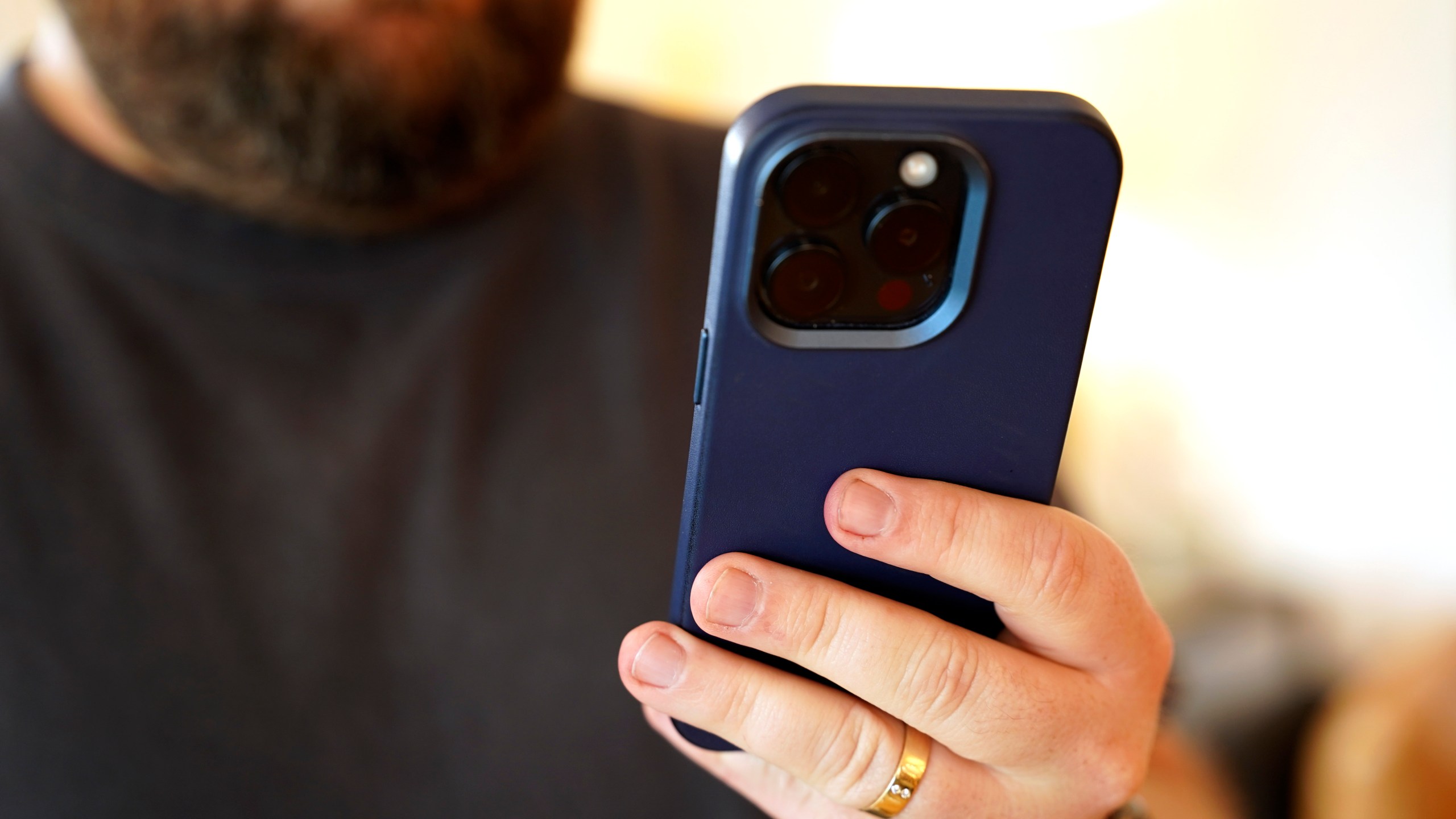 A person uses a cell phone on Saturday, July 13, 2024, in Los Angeles. The FBI Internet Crime Complaint Center reports that SIM-swapping complaints have increased more than 400% from 2018 to 2021. New federal regulations aimed at preventing port-out hijacking are under review, but it's not clear how far they will go in stopping the crime. When your own phone access is lost to a criminal, the very steps you once took to protect your accounts — such as two-factor authentication — can be used against you. (AP Photo/Paula Ulichney)