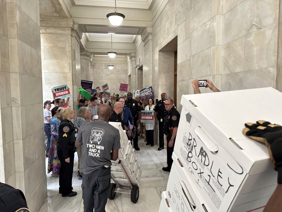 FILE - Boxes containing signatures supporting a proposed ballot measure to scale back Arkansas' abortion ban are delivered to a room in the state Capitol, Friday, July 5, 2024, in Little Rock, Ark. Supporters of a proposal to ask voters to scale back Arkansas’ abortion ban sued the state on Tuesday, July 16, for rejecting their petitions to get the measure on the November ballot. (AP Photo/Andrew DeMillo, File)