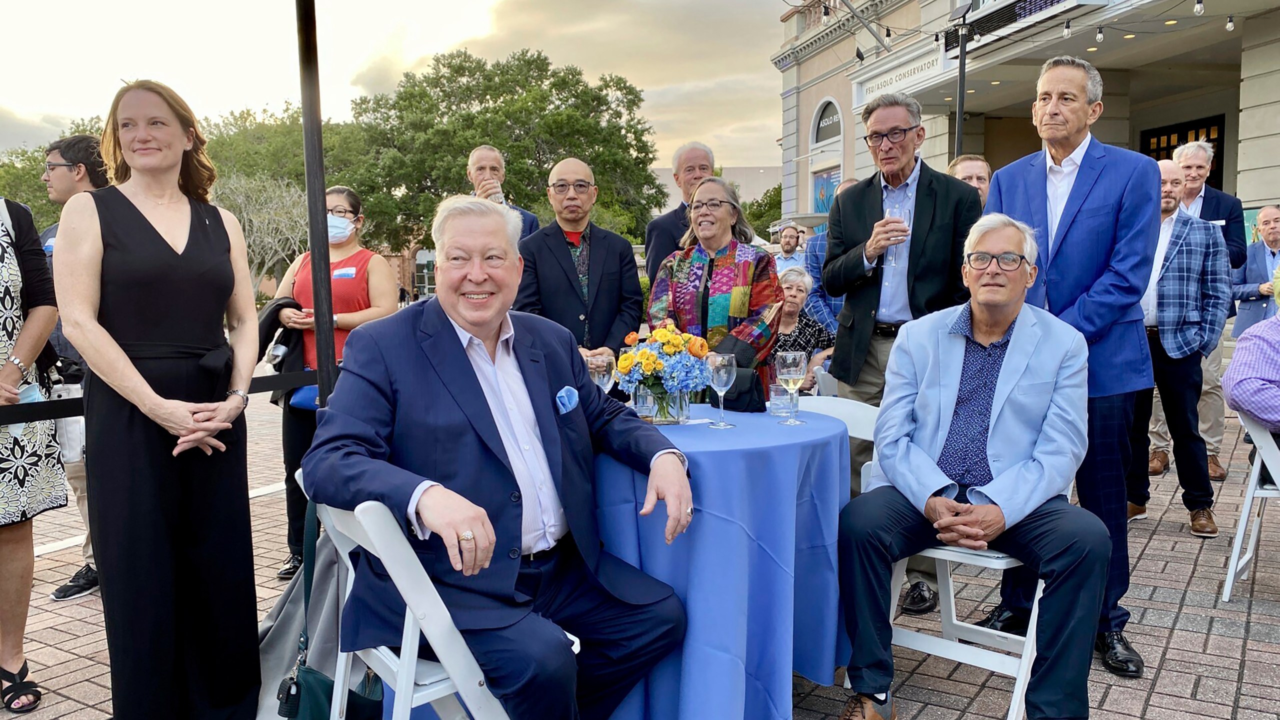 This image provided by Cynthia Moxley shows lottery winner Roy Cockrum (seated, front) at the 2022 opening night of “Knoxville” in Sarasota, Fla, surrounded by friends and board members of the Roy Cockrum Foundation. The foundation was the play’s major funder. (Cynthia Moxley via AP)