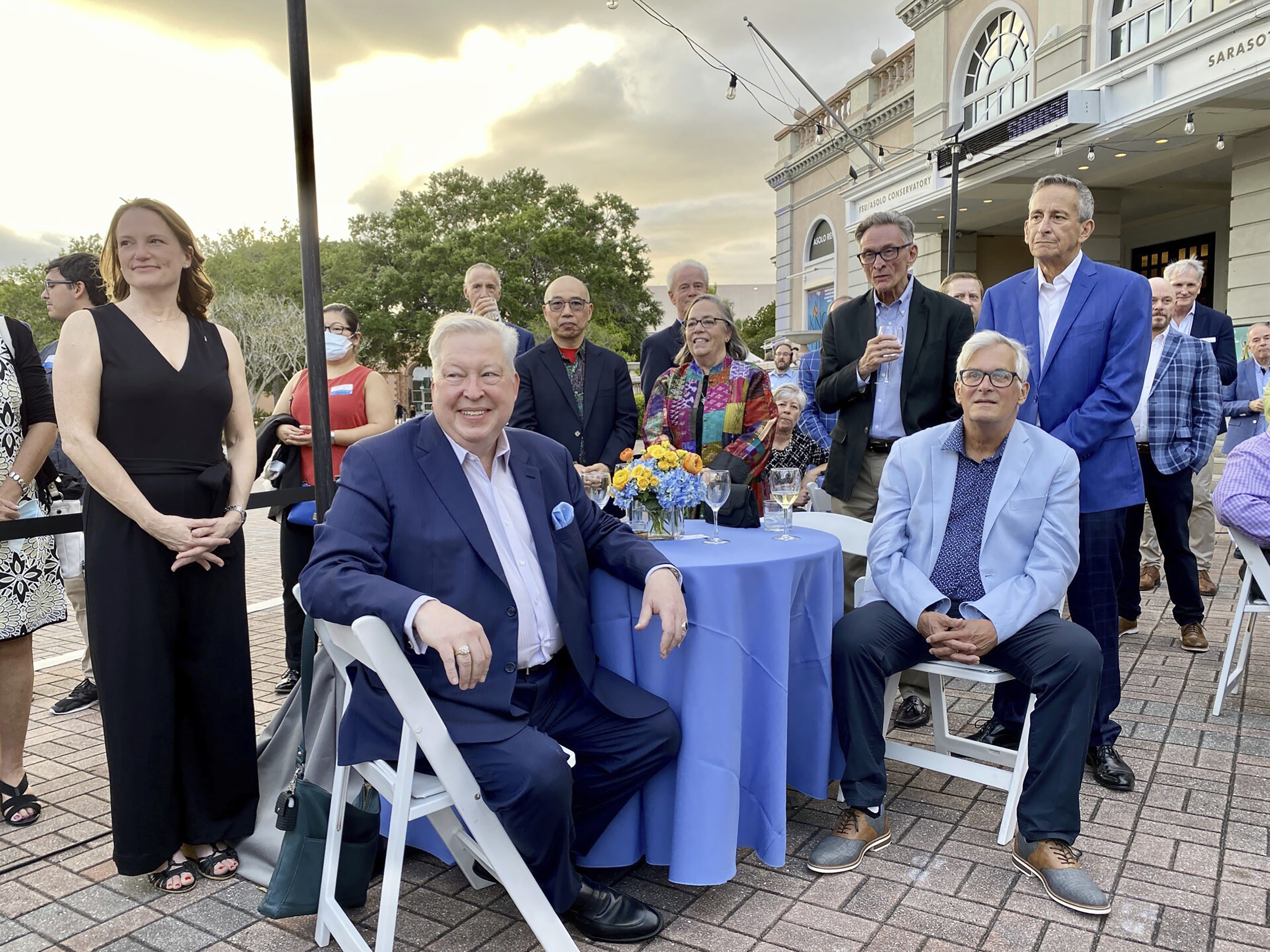 This image provided by Cynthia Moxley shows lottery winner Roy Cockrum (seated, front) at the 2022 opening night of “Knoxville” in Sarasota, Fla, surrounded by friends and board members of the Roy Cockrum Foundation. The foundation was the play’s major funder. (Cynthia Moxley via AP)