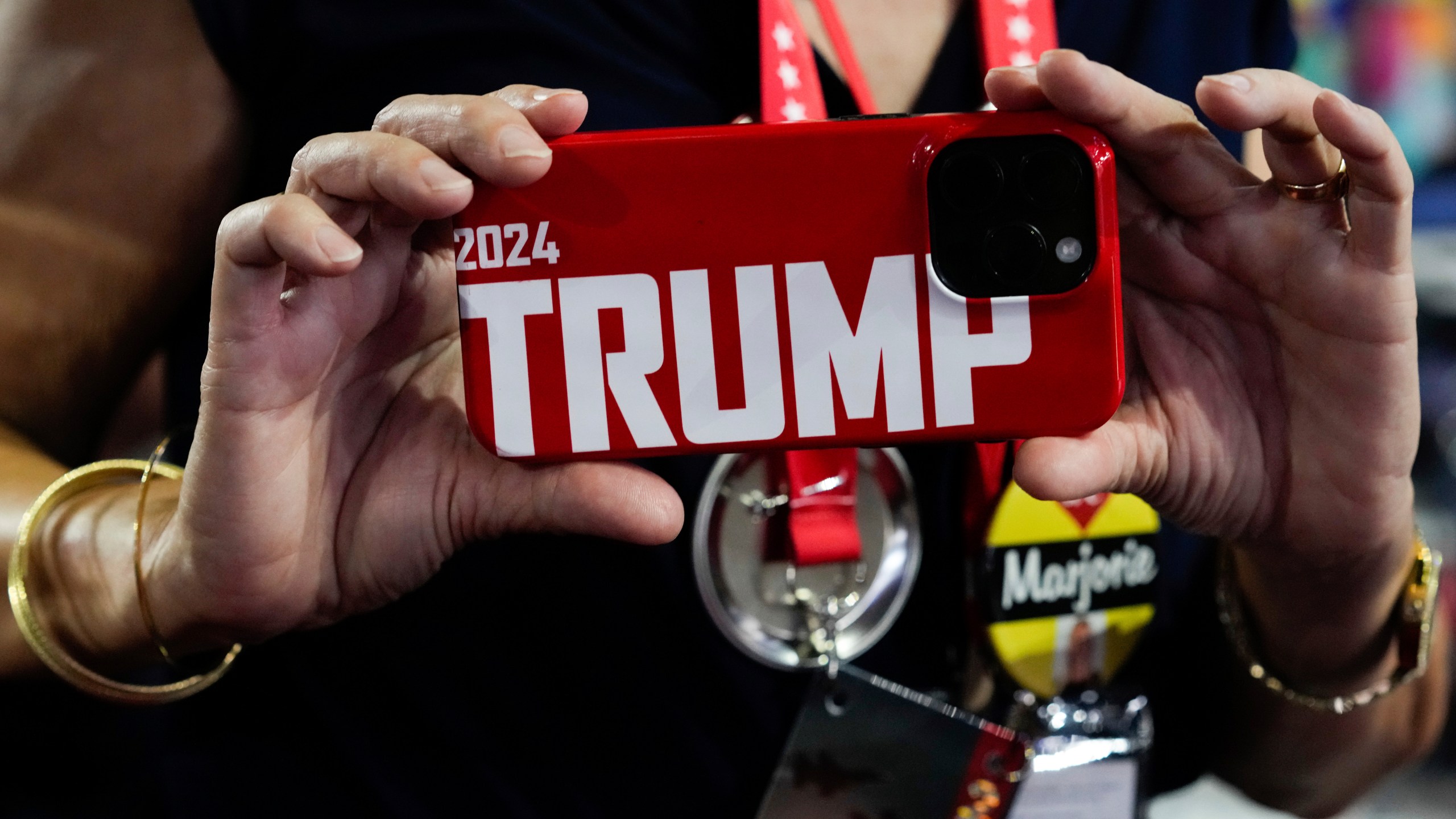 Georgia delegate Kathleen Thornman takes a picture with her phone during the Republican National Convention Tuesday, July 16, 2024, in Milwaukee. (AP Photo/Nam Y. Huh)