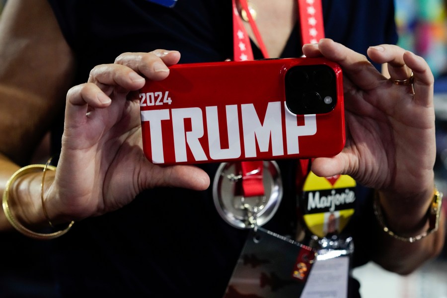 Georgia delegate Kathleen Thornman takes a picture with her phone during the Republican National Convention Tuesday, July 16, 2024, in Milwaukee. (AP Photo/Nam Y. Huh)