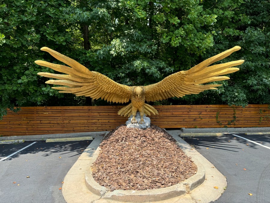 A hawk statue from Francis Ford Coppola's film "Megalopolis" in the parking lot of Coppola's The All-Movie Hotel shown on Monday, July 15, 2024, in Peachtree City, Ga. The hotel is a mixed-use property for production companies and tourists excited about film. (AP Photo/Charlotte Kramon)