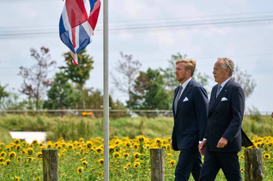 Dutch King Willem Alexander, left, arrives with Piet Ploeg, to attend a commemoration at the national monument in Vijfhuizen, Netherlands, Wednesday July 17, 2024, to mark the tenth anniversary of the downing of flight MH17 in eastern Ukraine, which killed all 298 people on board. (AP Photo/Phil Nijhuis)