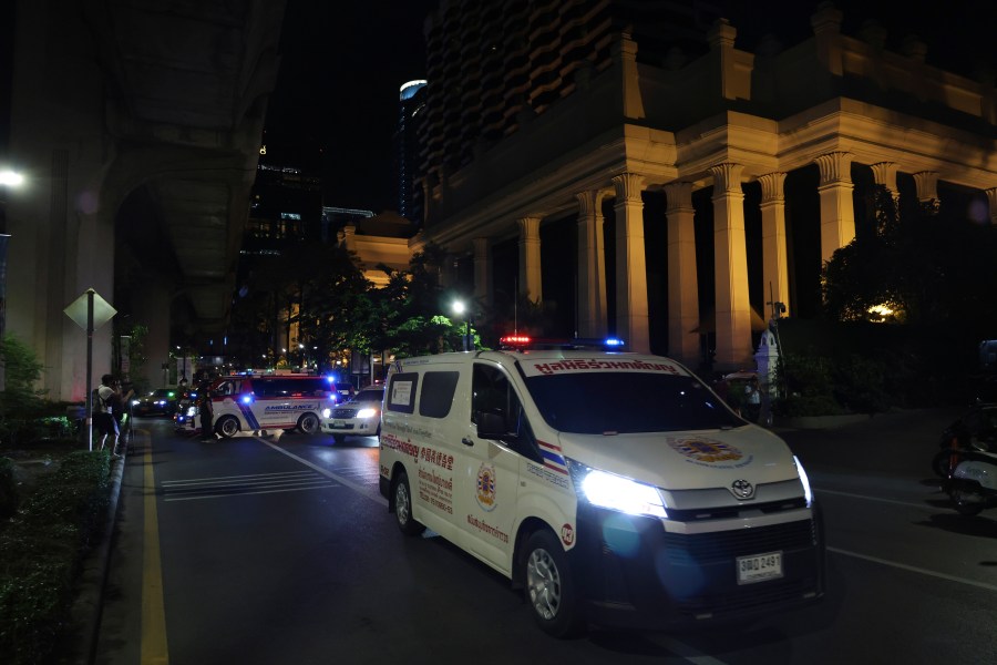 An ambulance sits outside the Grand Hyatt Erawan Hotel to Chulalongkorn hospital in Bangkok, Thailand, Tuesday, July 16, 2024. Police say the bodies of six people were found in the luxury hotel in downtown Bangkok. (AP Photo/Chatkla Samnaingjam)