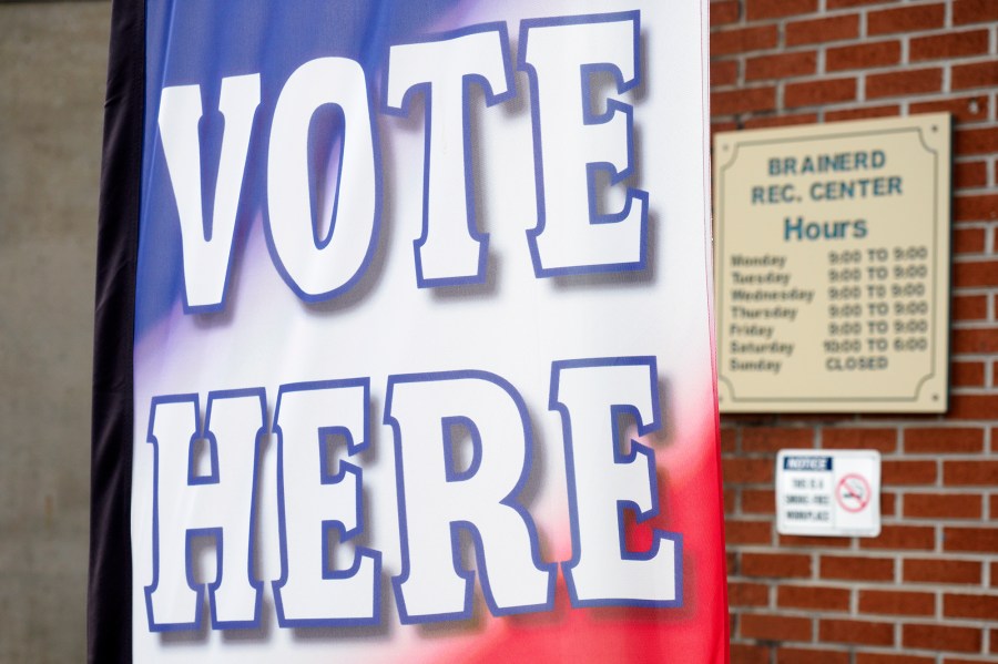 FILE - A "vote here" sign is seen at the Brainerd Youth and Family Development Center, Aug. 1, 2020, in Chattanooga, Tenn. Tennessee's top election office sent letters to more than 14,000 registered voters asking them to prove their citizenship, a move that alarmed voting rights advocates as possible intimidation. (C.B. Schmelter/Chattanooga Times Free Press via AP, File)